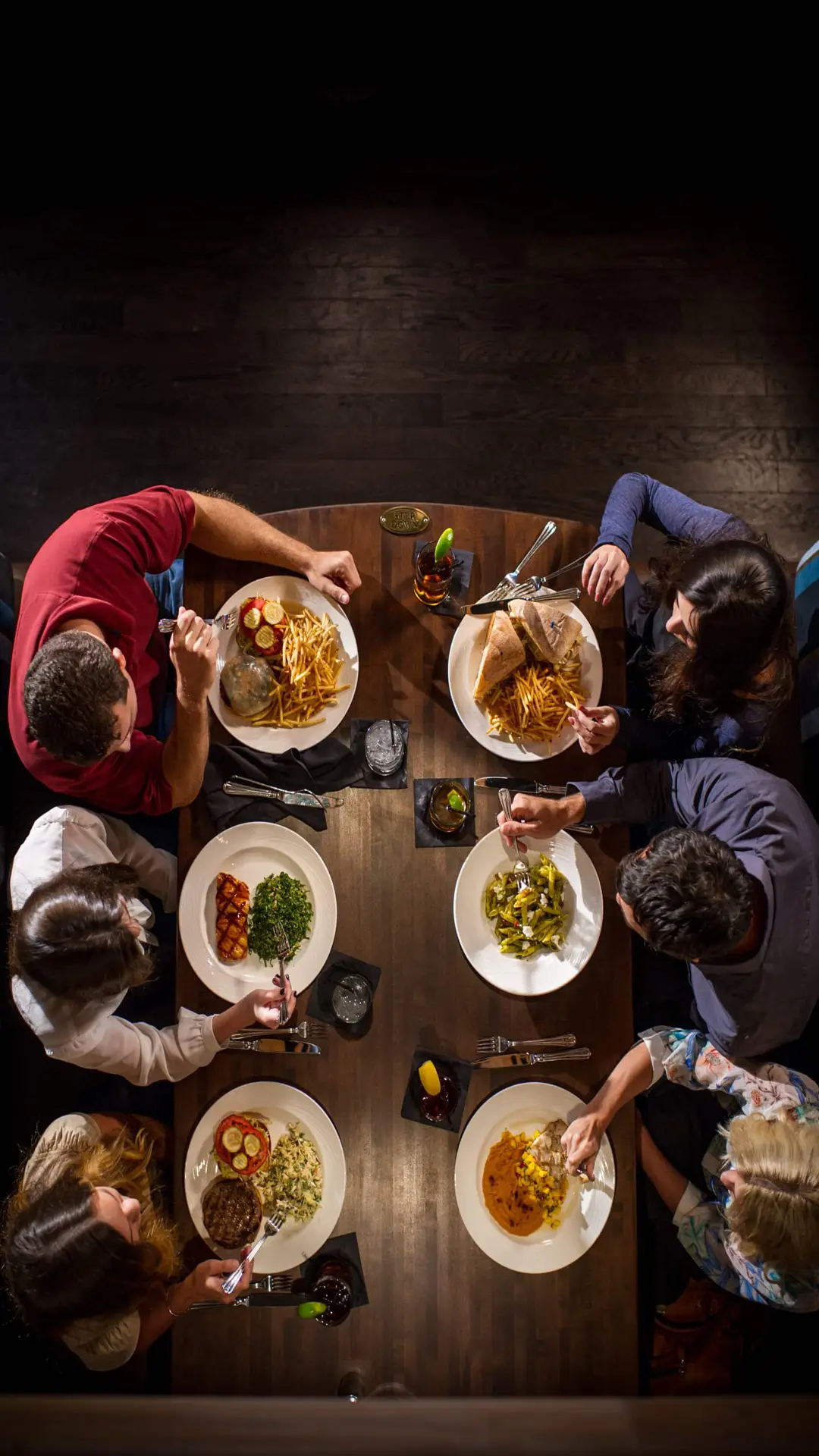 Gold Coast Magazine 74 Overhead view of six people enjoying dinner