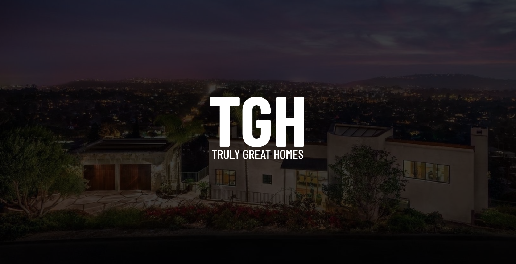 White TGH Truly Great Homes title Santa Barbara California on dimmed background of a large house with two car garage