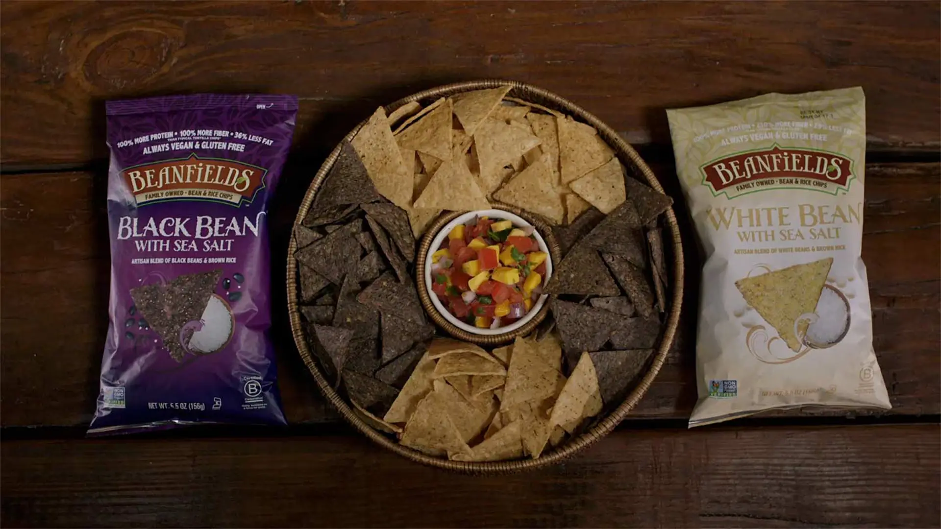Beanfields Snacks 235 Platter of chips and salsa with a bag of chips on either side