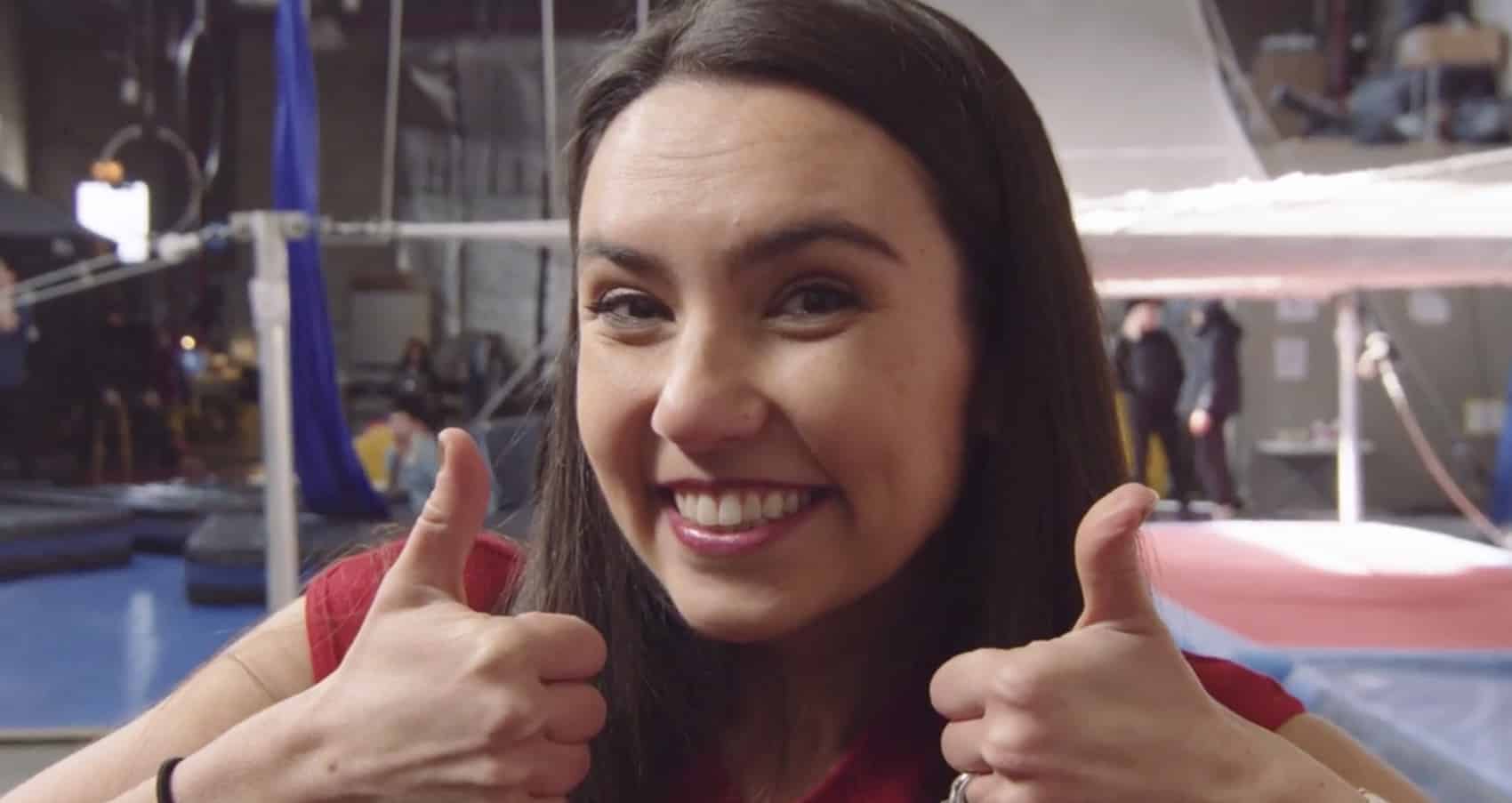 Headshot of woman smiling and giving thumbs up