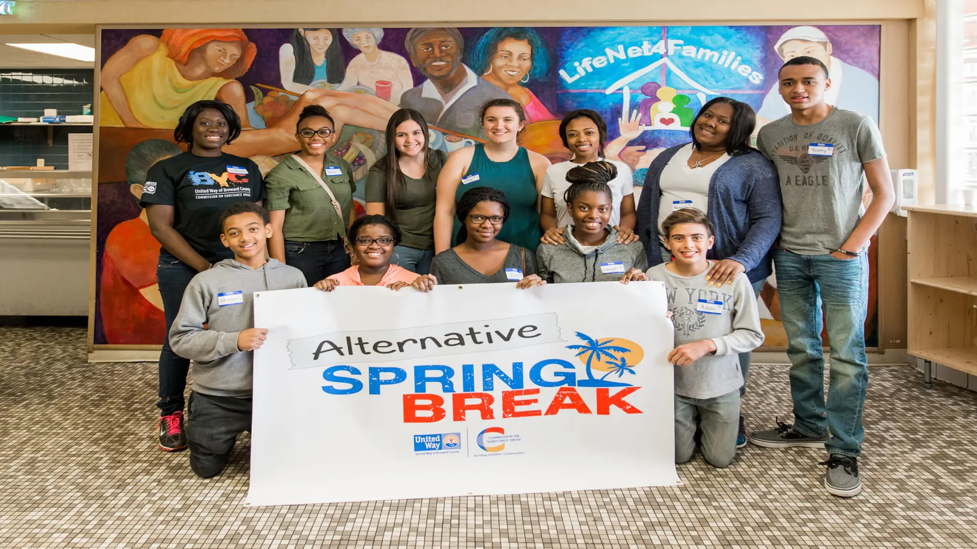 United Way 226 Group of people posing for camera holding an Alternative to Spring Break banner