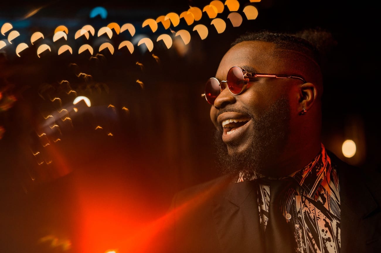 Side view of a African American man with beard smiling