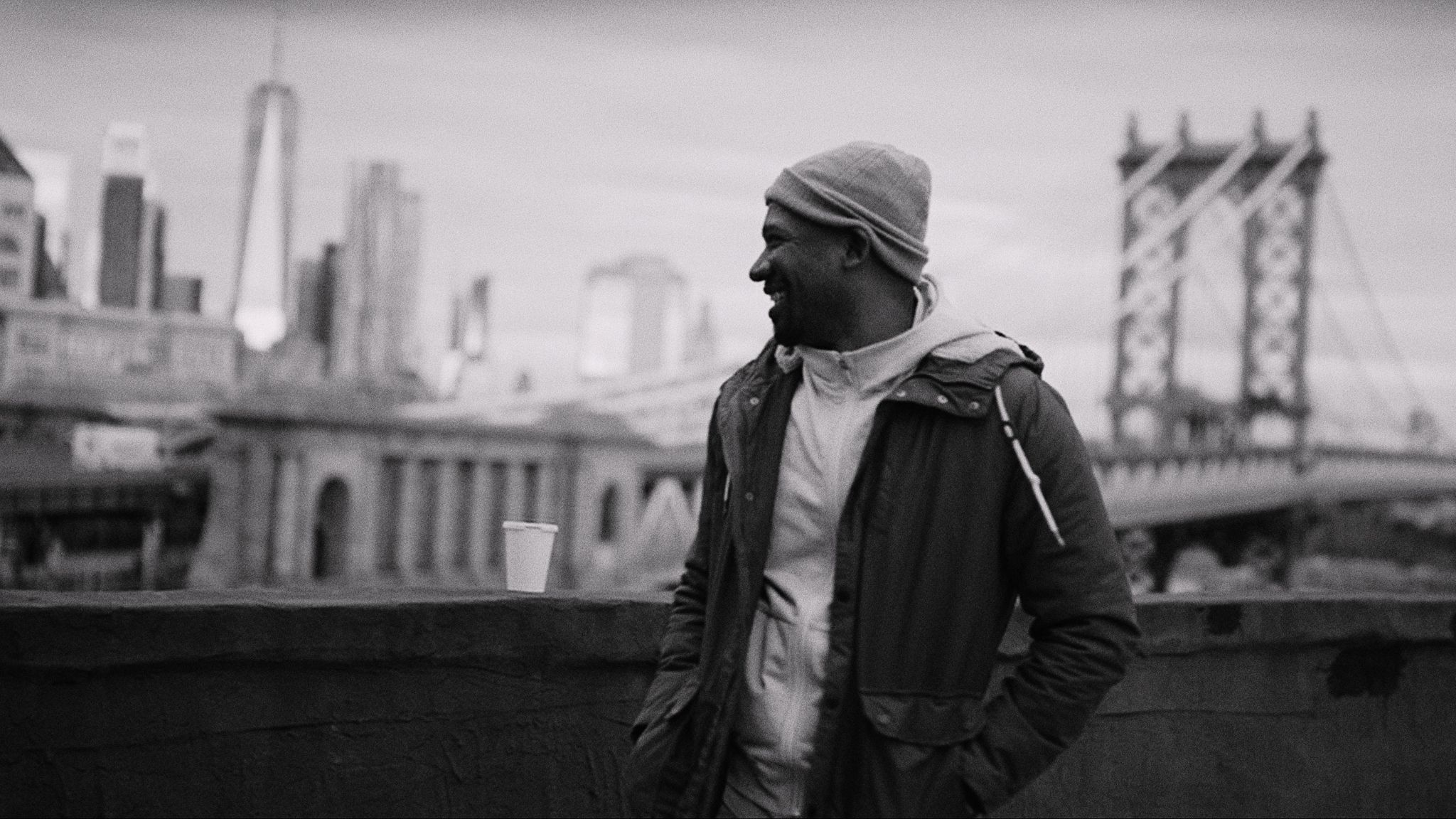 From NY, I Love You Black and white of Joshua looking off over the city smiling