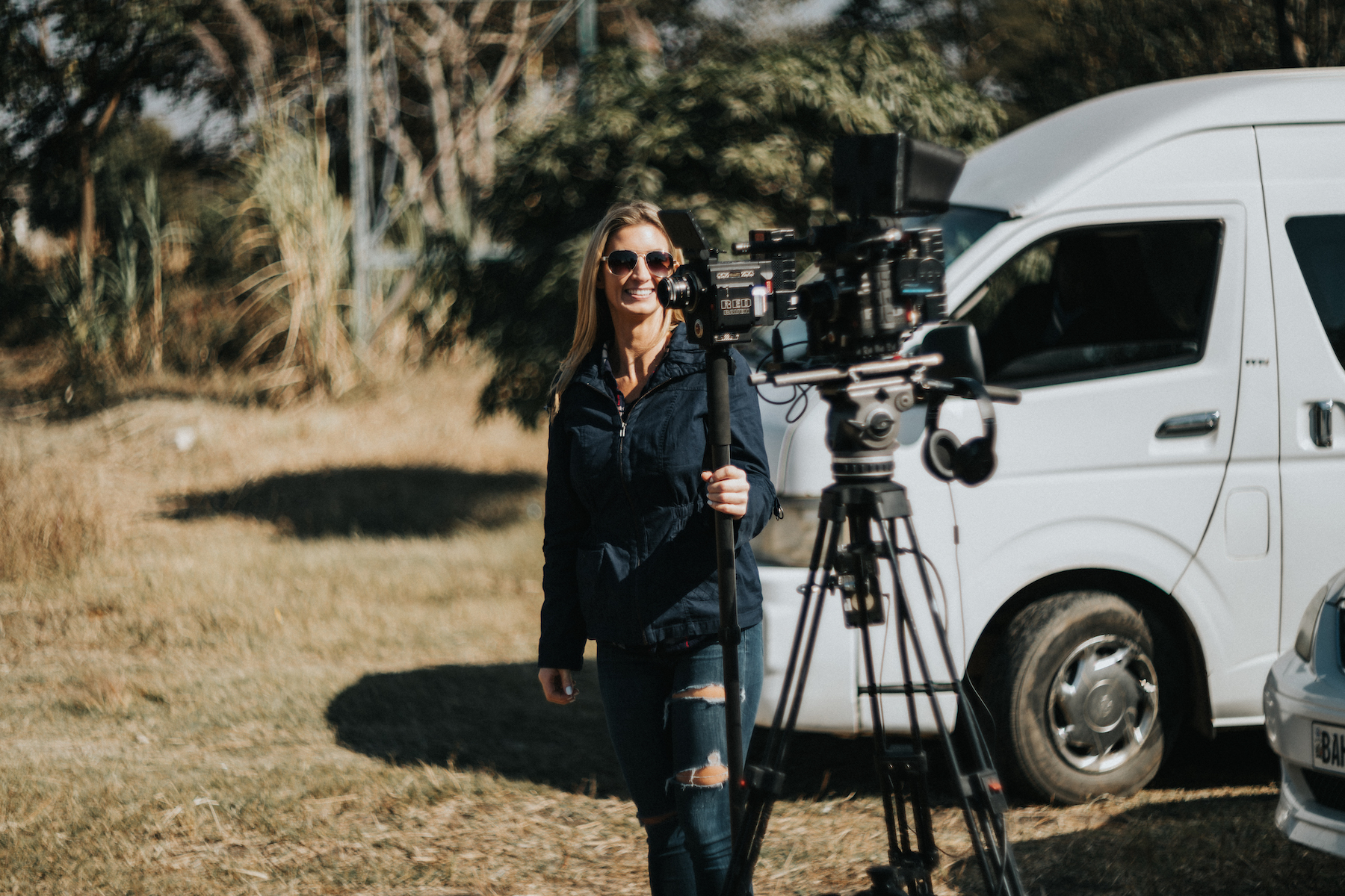 Video Marketing Woman with video equipment smiling for the camera