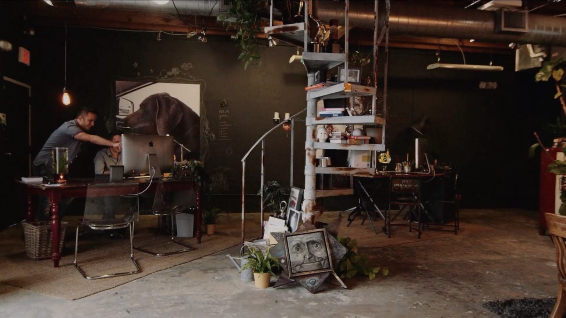 Two young men working in an art studio.