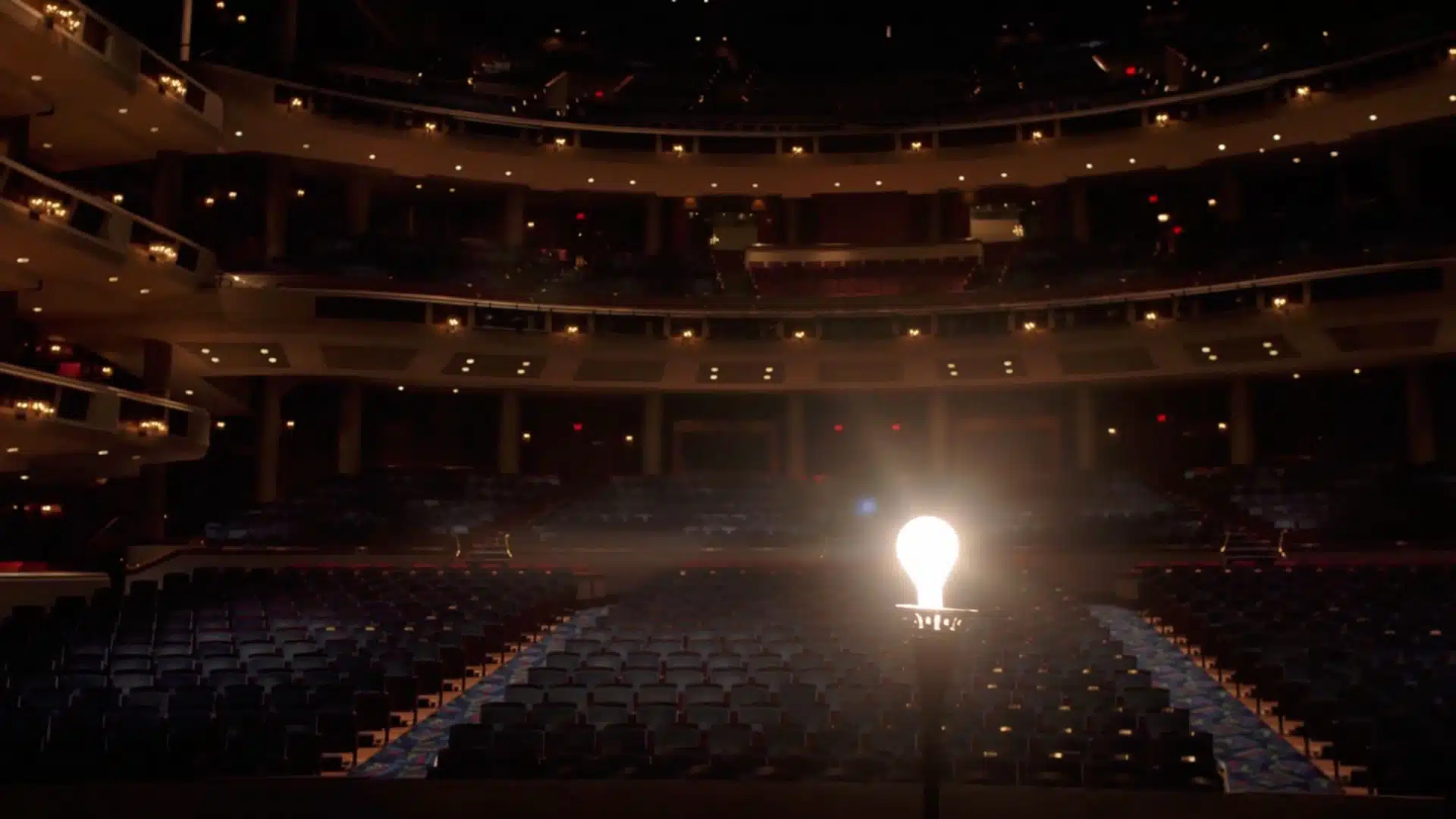 Interior view of Broward Center for the Performing Arts with bare lightbulb on stage