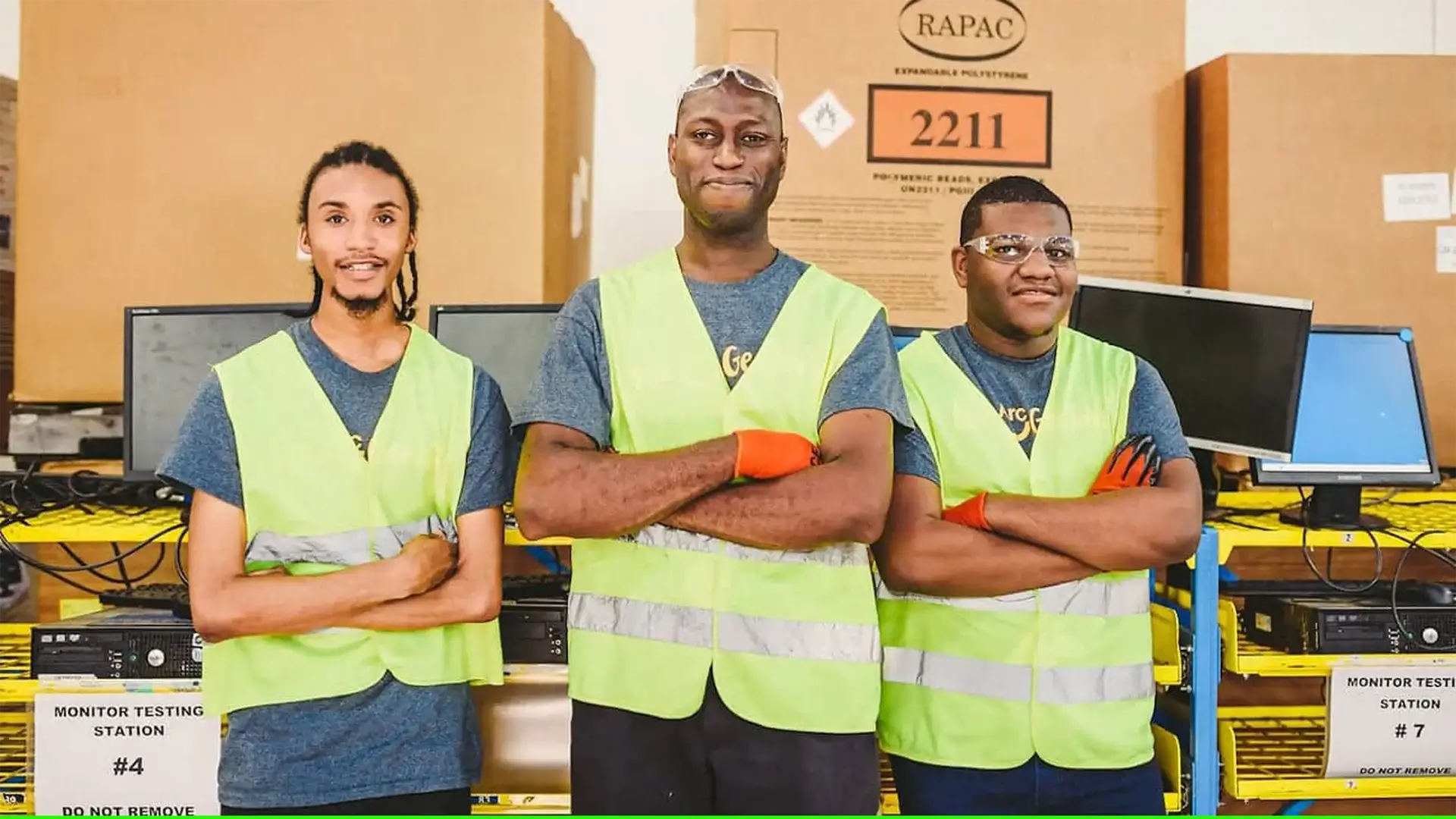 post-amazon-go-friend-or-foe Three Amazon Go stock employees wearing bright vests in front of merchandise posing for camera.