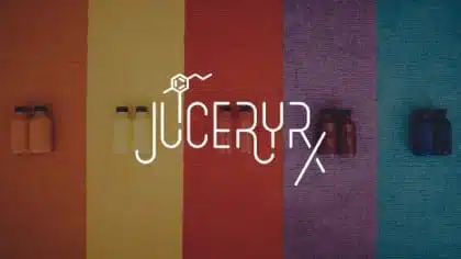 IU C&I Studios Page JuiceryRx Marketing Solutions by C&I Studios An Idea Agency White JuiceryRx logo against multicolored background