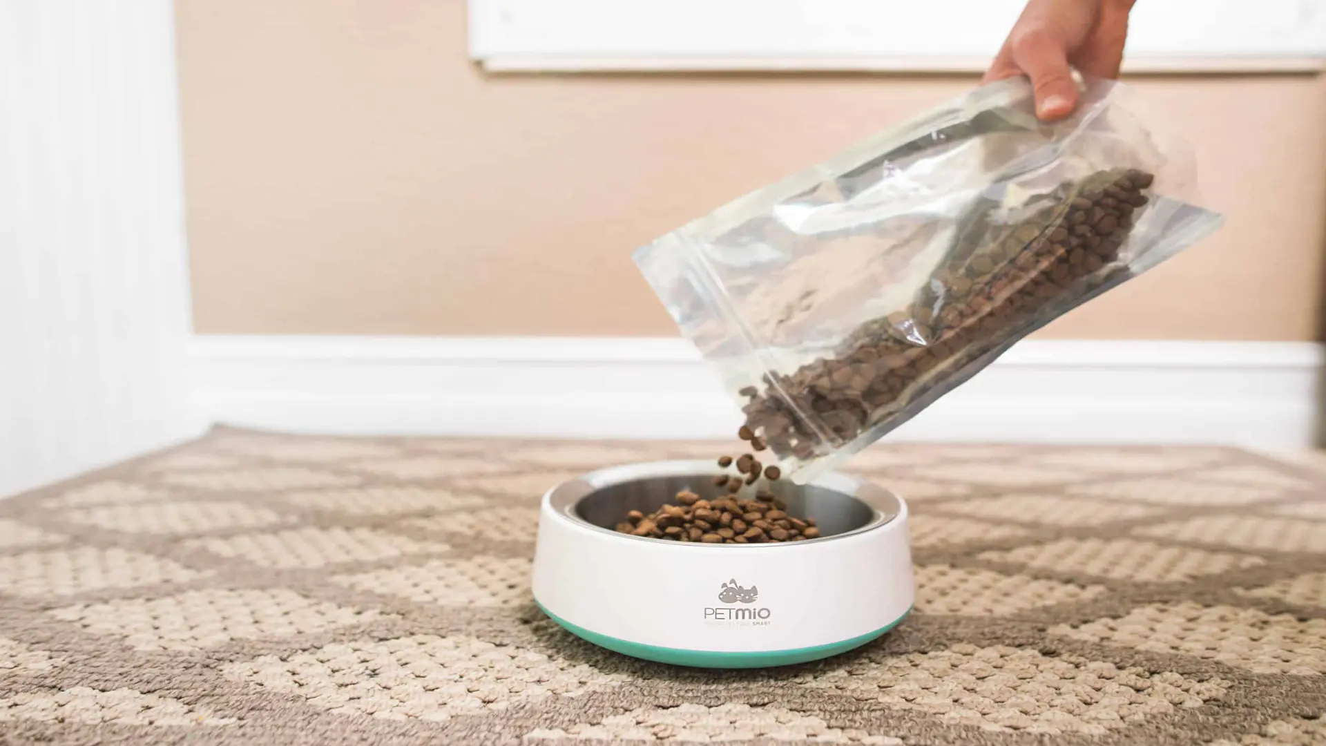 PetMio 118 Packet of pet food being poured into a PetMio bowl
