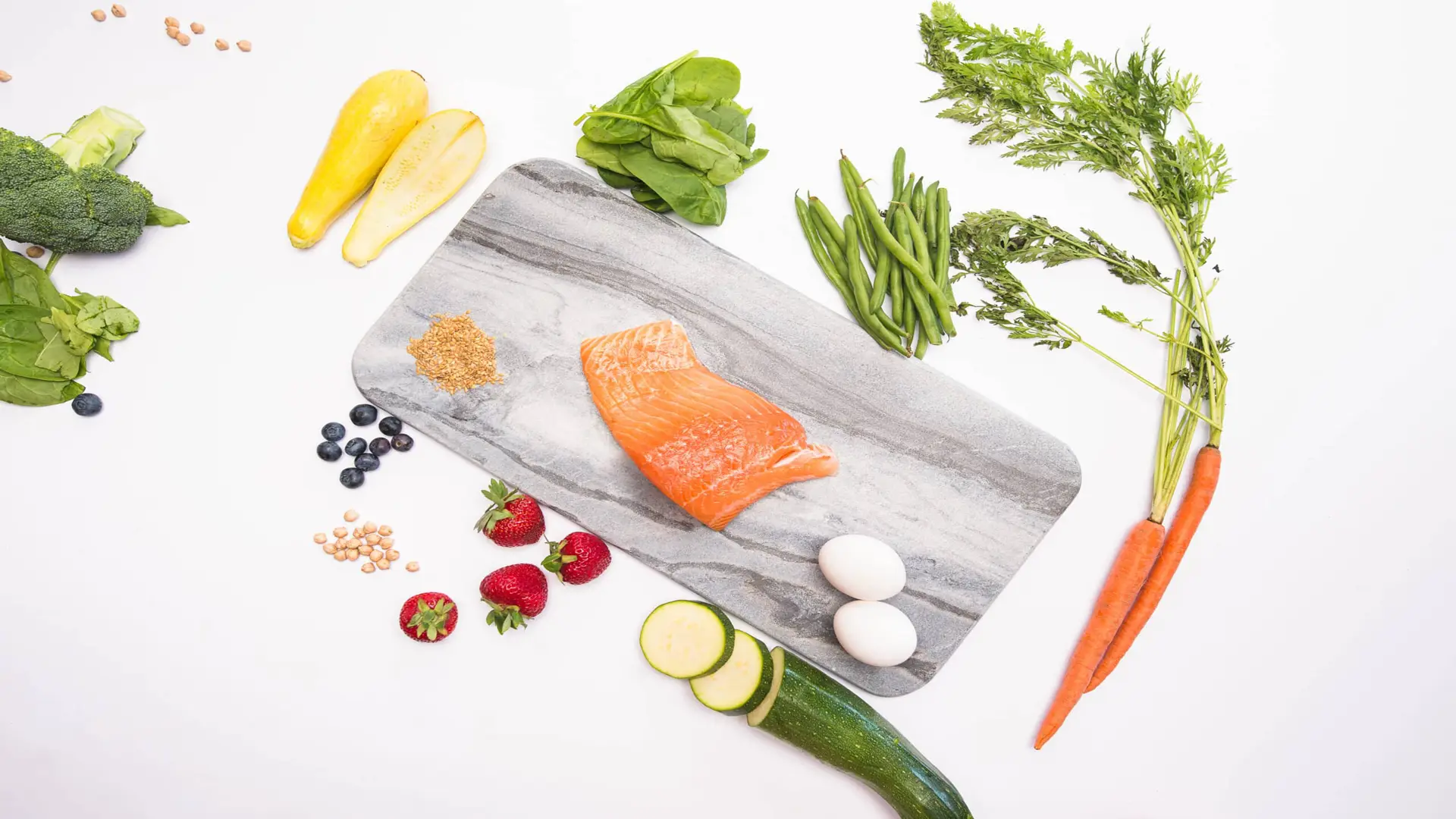 PetMio 120 Overhead view of Salmon surrounded by various vegetables and fruit