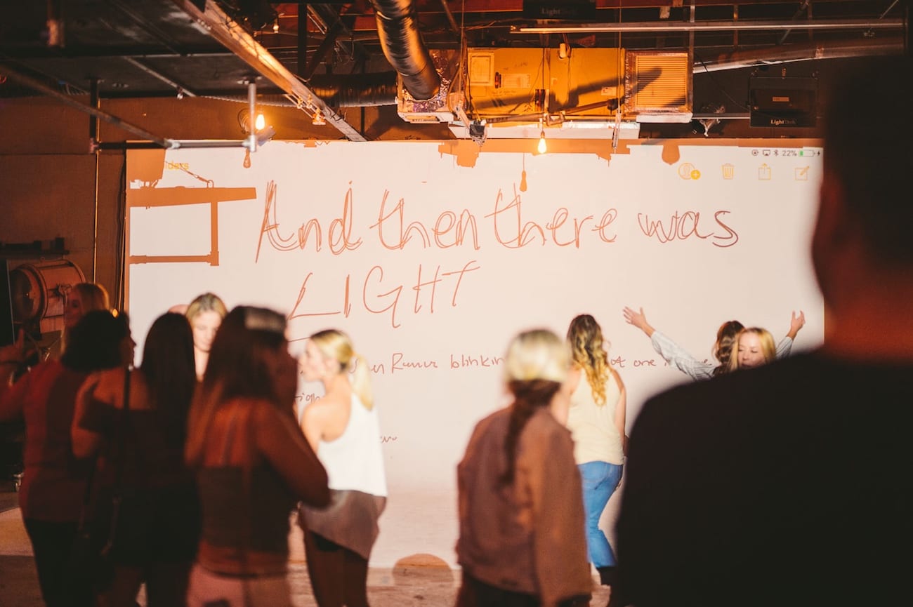 C&I Storm C&I Storm at FATVillage Artwalk Group of people looking at writing on backdrop