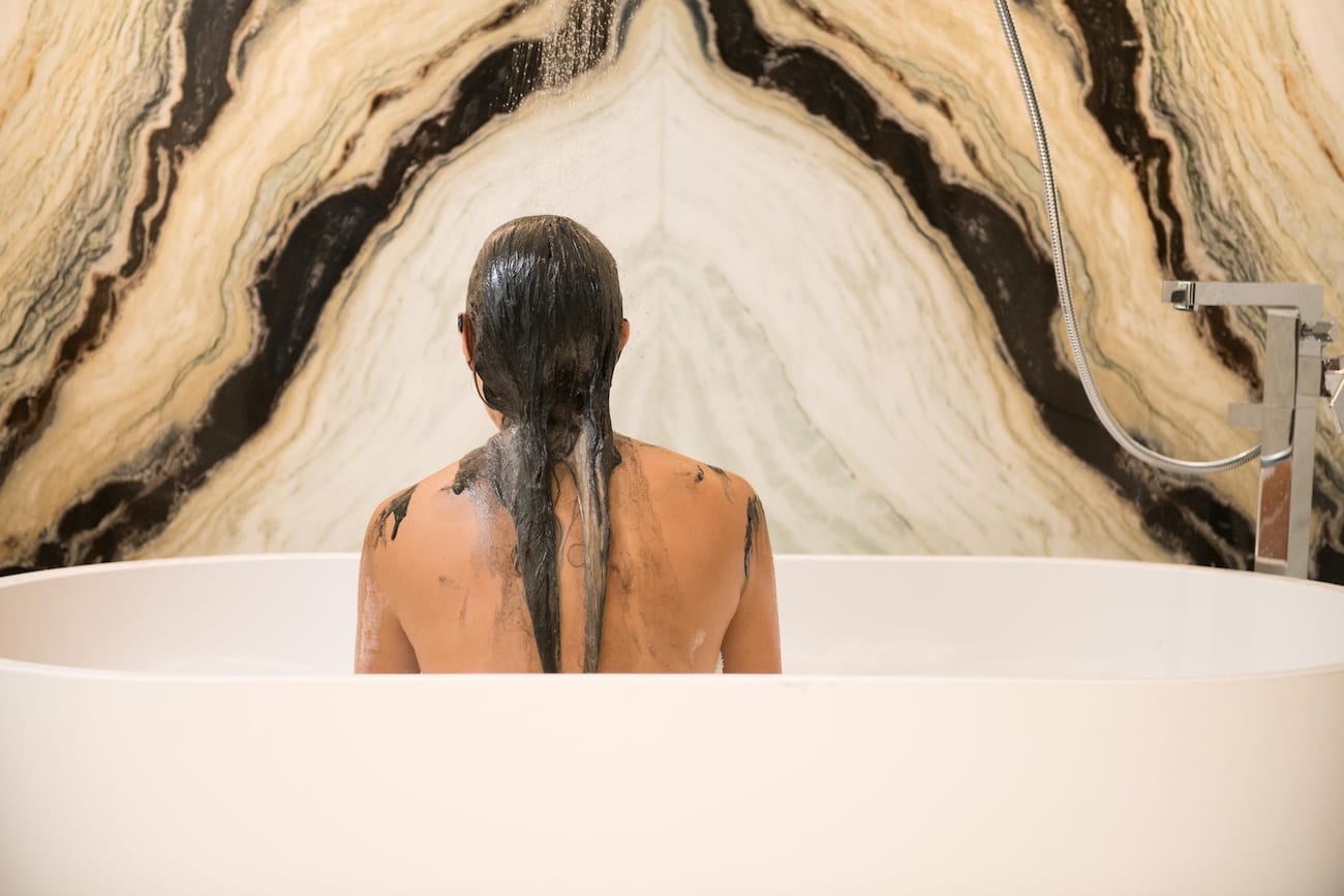 HauteHouse Brands Theorie and Sedu Woman in a bathtub that just applied hair dye