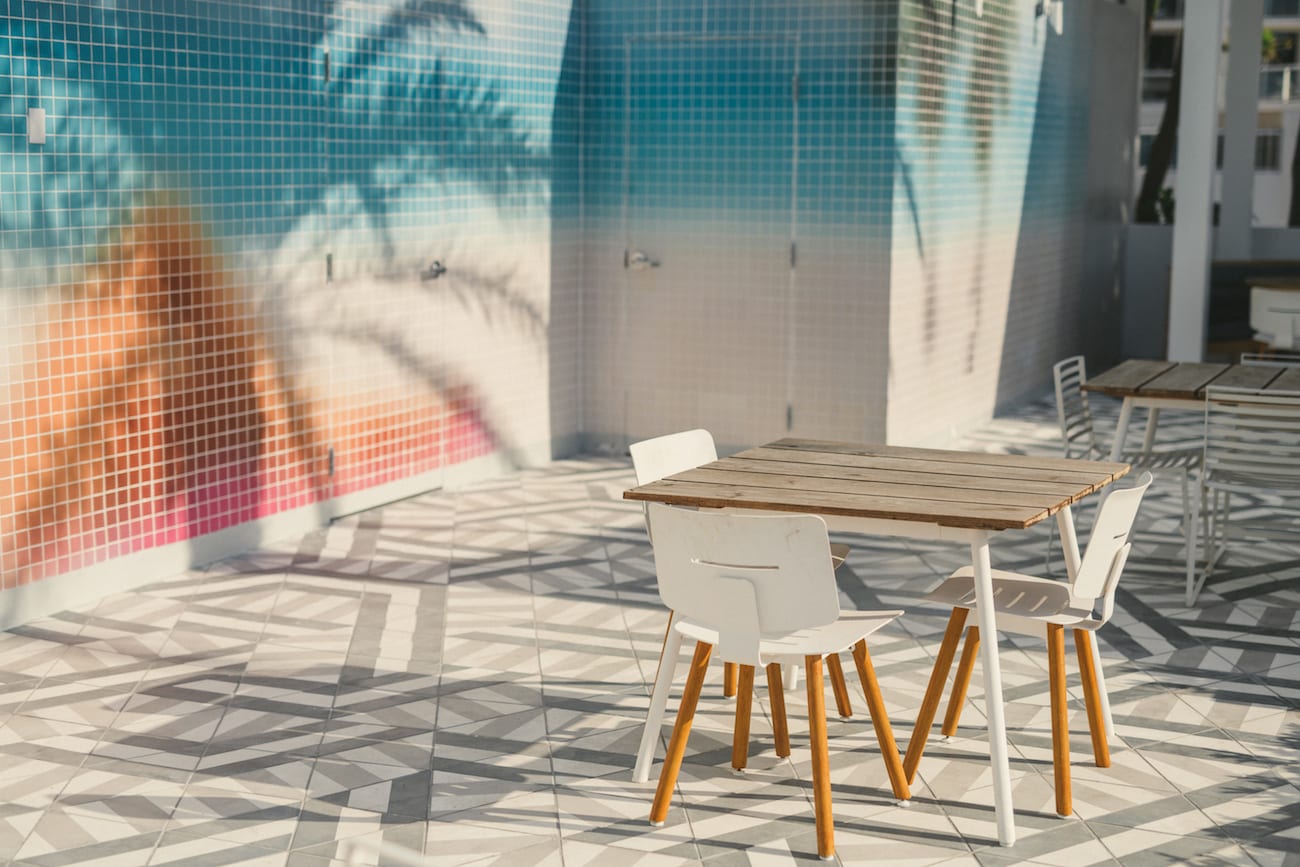 IU C&I Studios Portfolio W Fort Lauderdale Residences Marketing Solutions by C&I An Idea Agency View of patio with tables and chairs