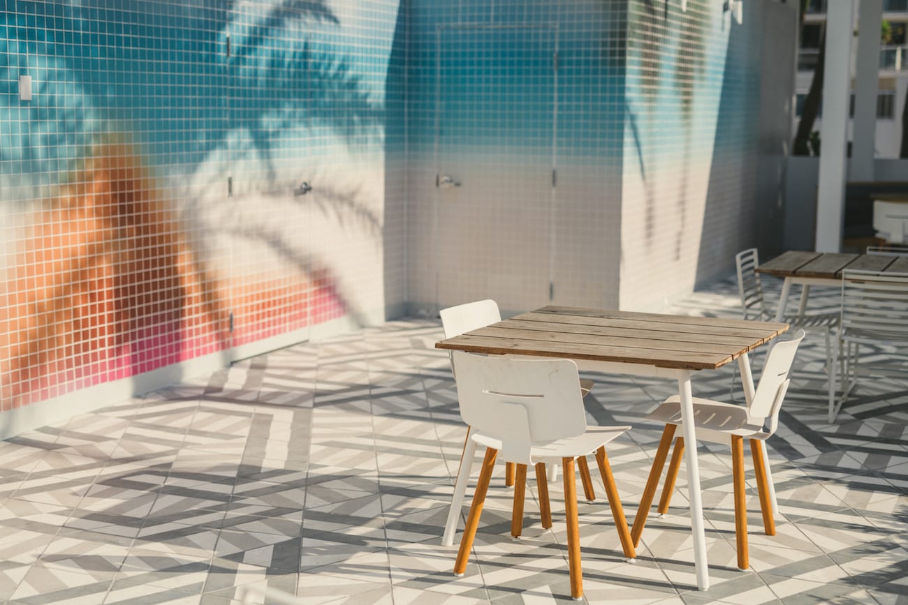 View of patio with tables and chairs