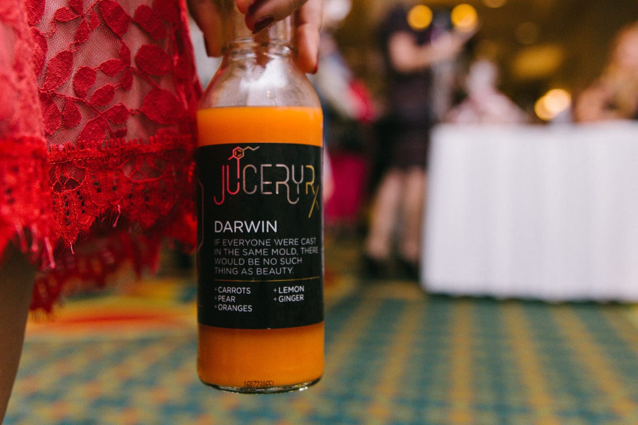 Juicery RX Marketing Solutions by C&I An Idea Agency Darwin flavored juice being displayed next to woman in red dress