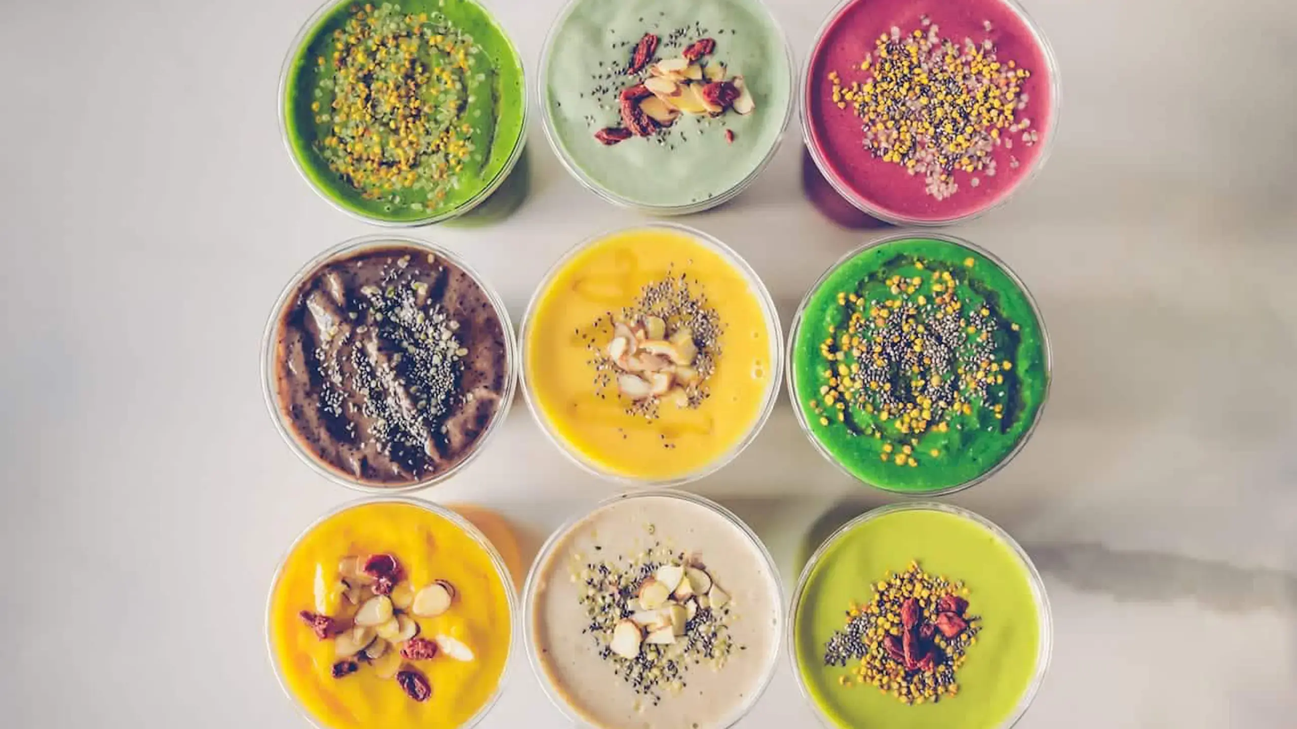 Juicery RX 20 View from above of nine different smoothies on display