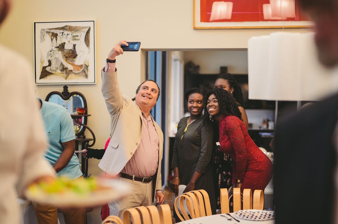 Man making a selfie with a group of women