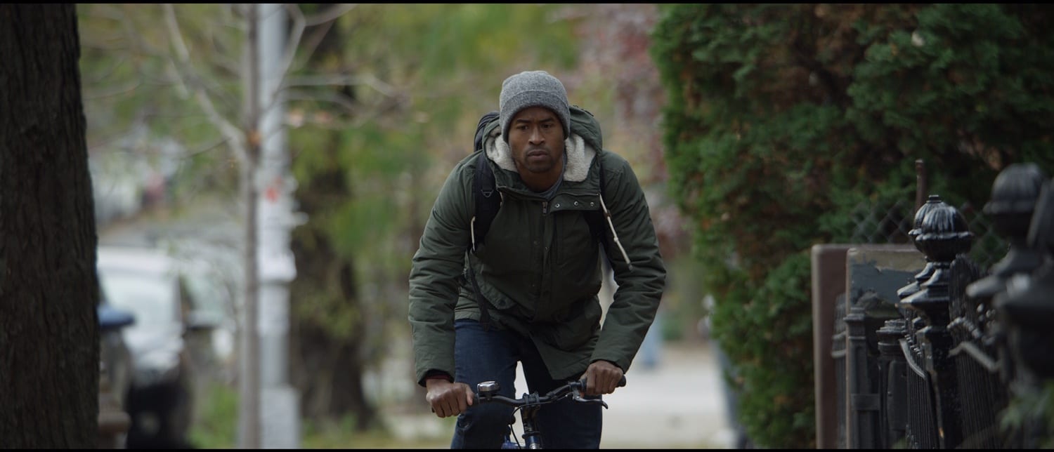 IU Christmas Eve poster frame African American man riding a bike