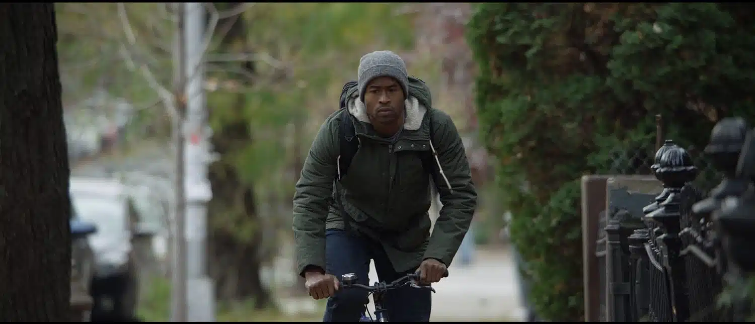 African American man riding a bike