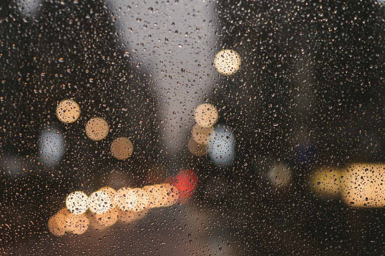 View through rain covered windshield
