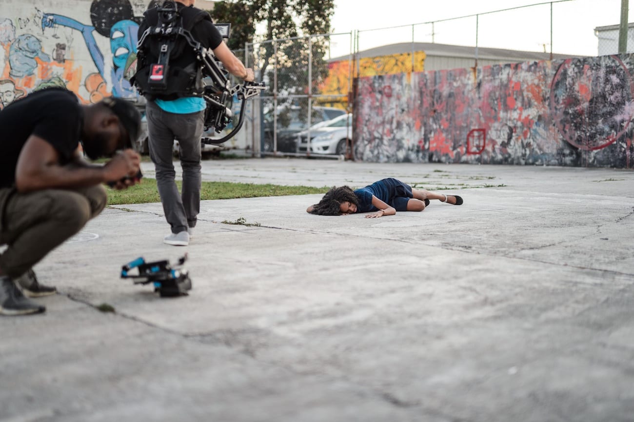 OneUnited BTS 21 Advertising Agency in Fort Lauderdale Protester being filmed by video cameraman laying on the ground