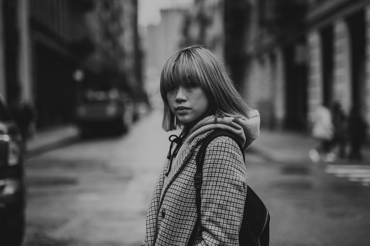 Black and white of Asian woman posing for the camera