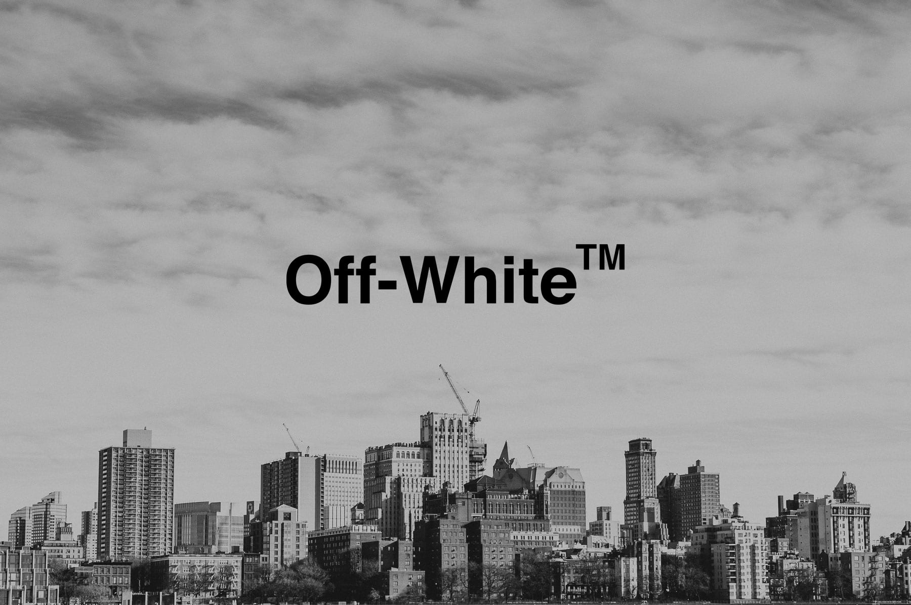 IU C&I Studios Page Black Off White logo on a city under construction backdrop