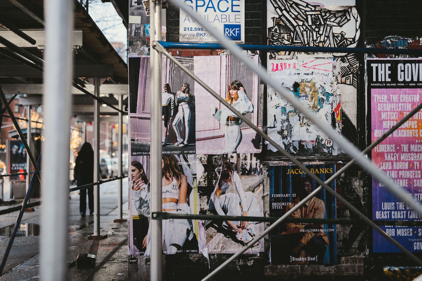 Ads on a wall in a city