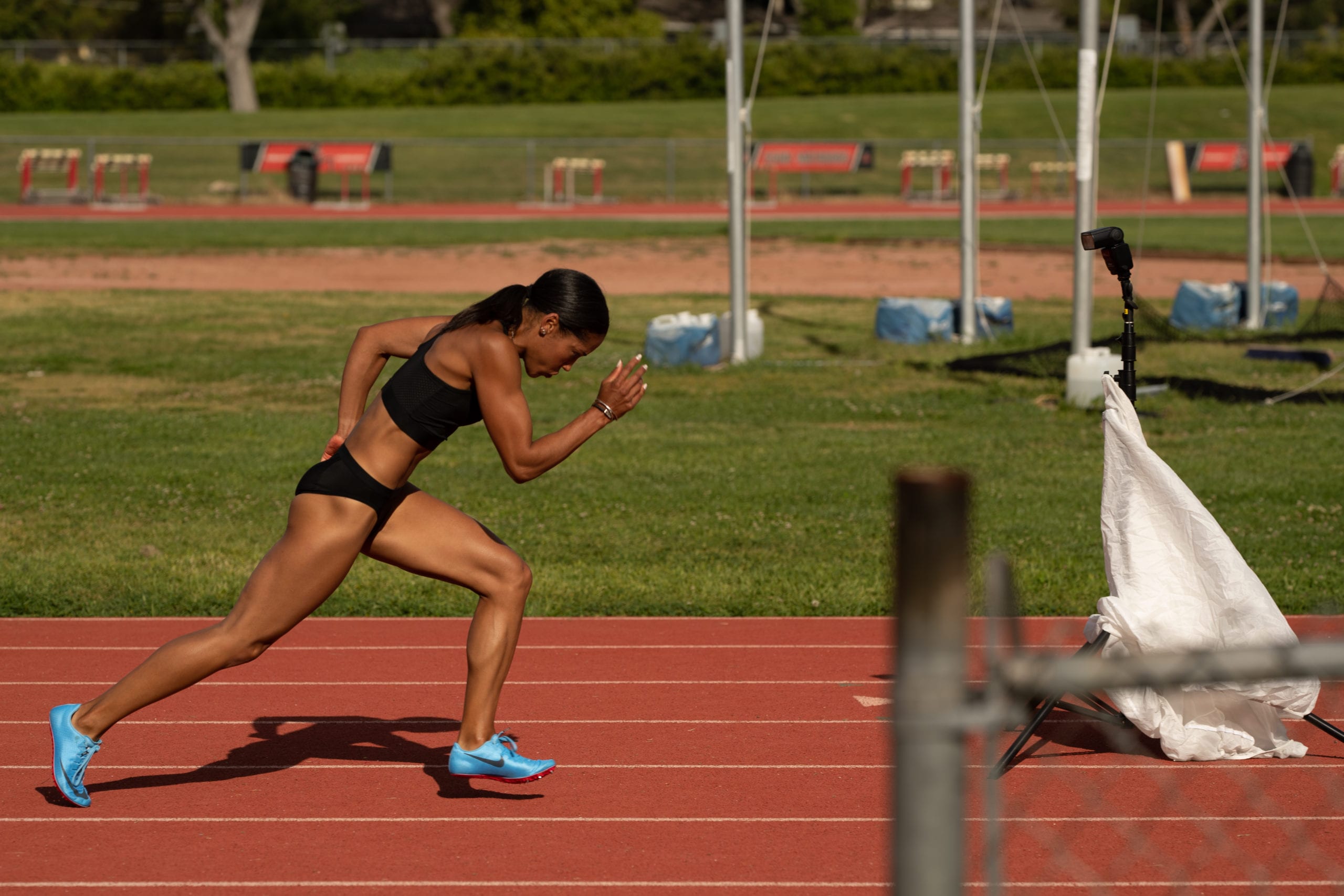 IU CI Studios Portfolio Karelle Edwards Canadian Olympic Athlete running on a track
