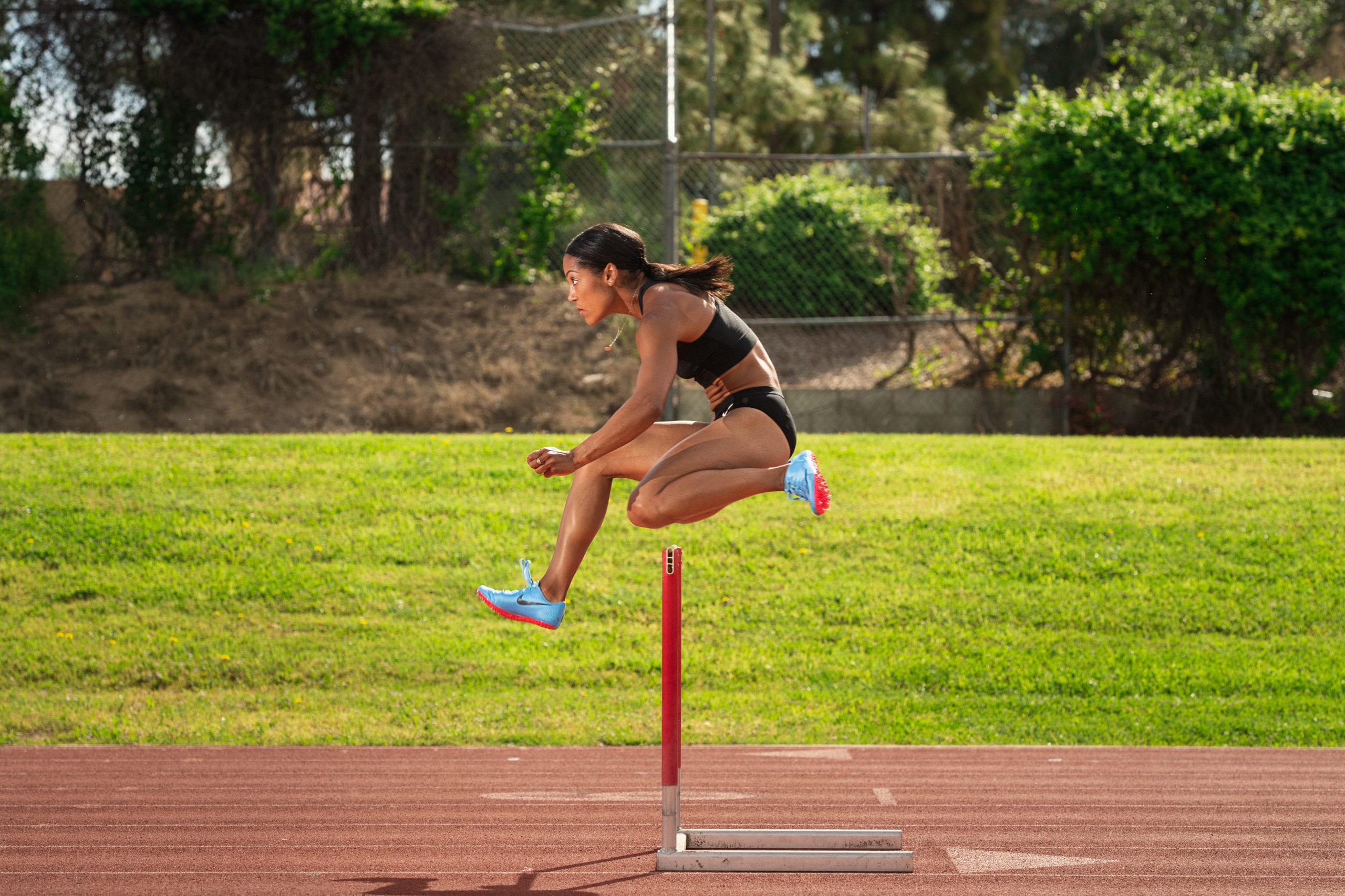 IU CI Studios Portfolio Karelle Edwards Canadian Olympic Athlete jumping a hurdle