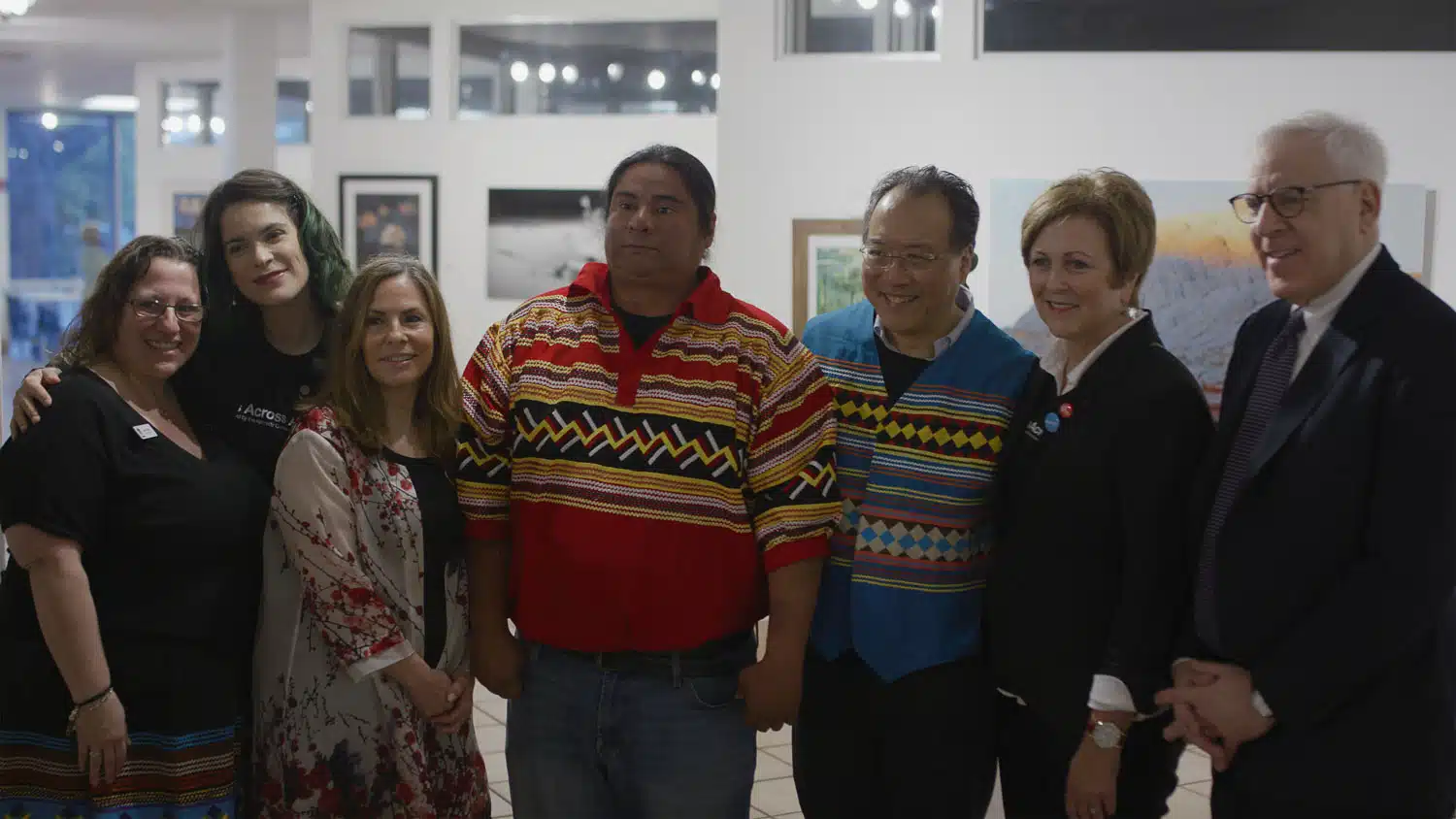 Group of for women and three men posing for the camera
