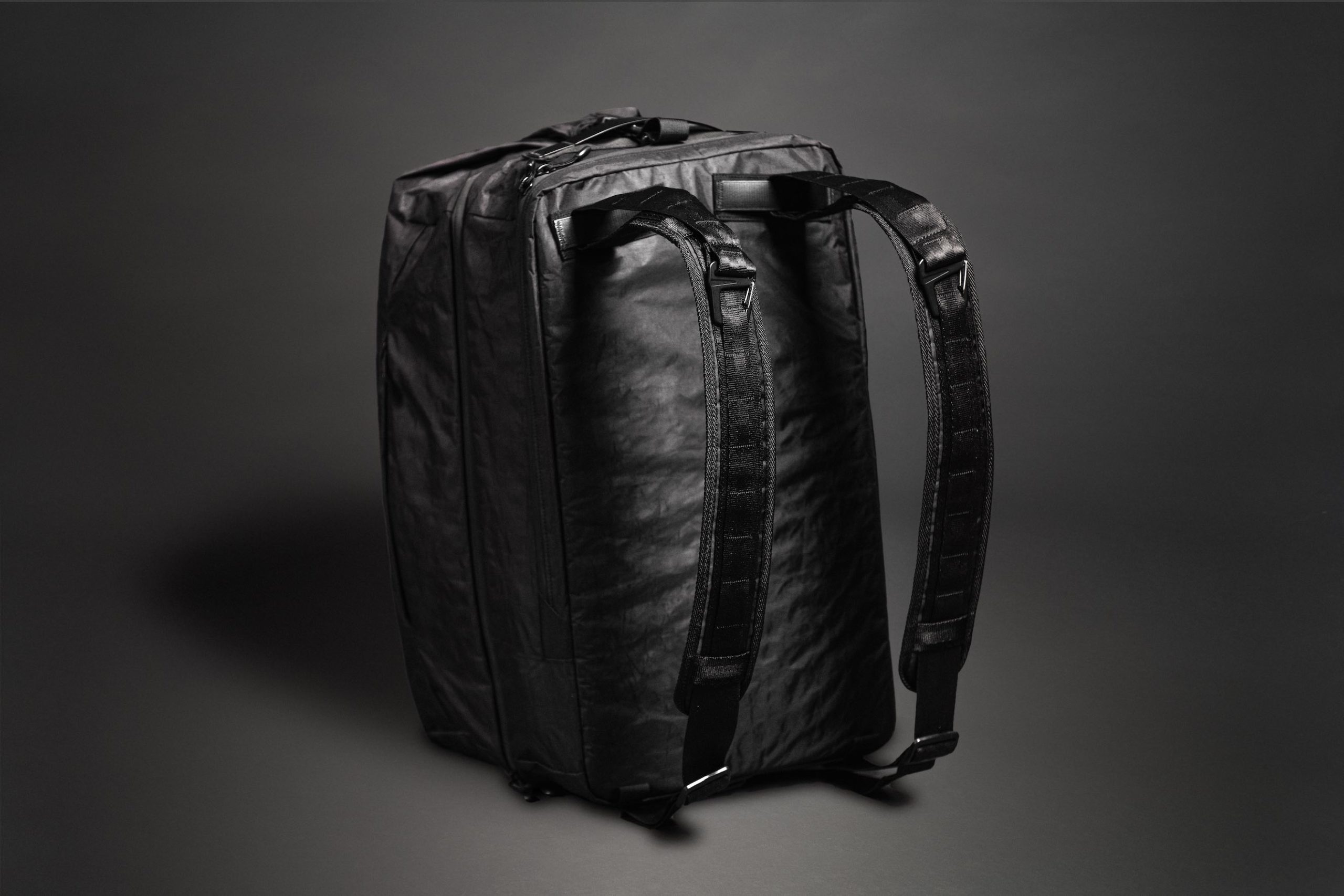 Black Mile Travel Bag Product Photography Black backpack on display