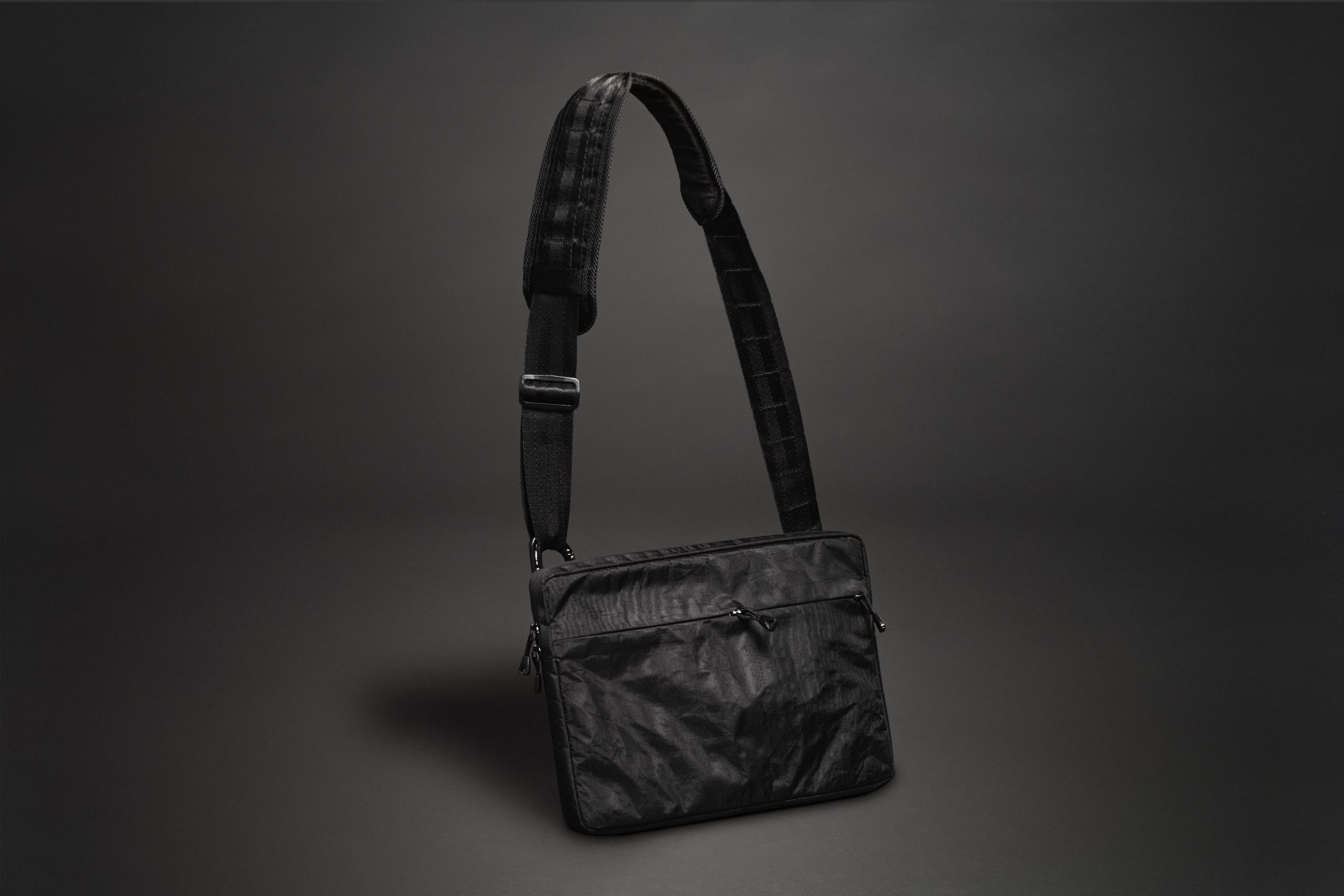 Black Mile Travel Bag Product Photography Black purse on display