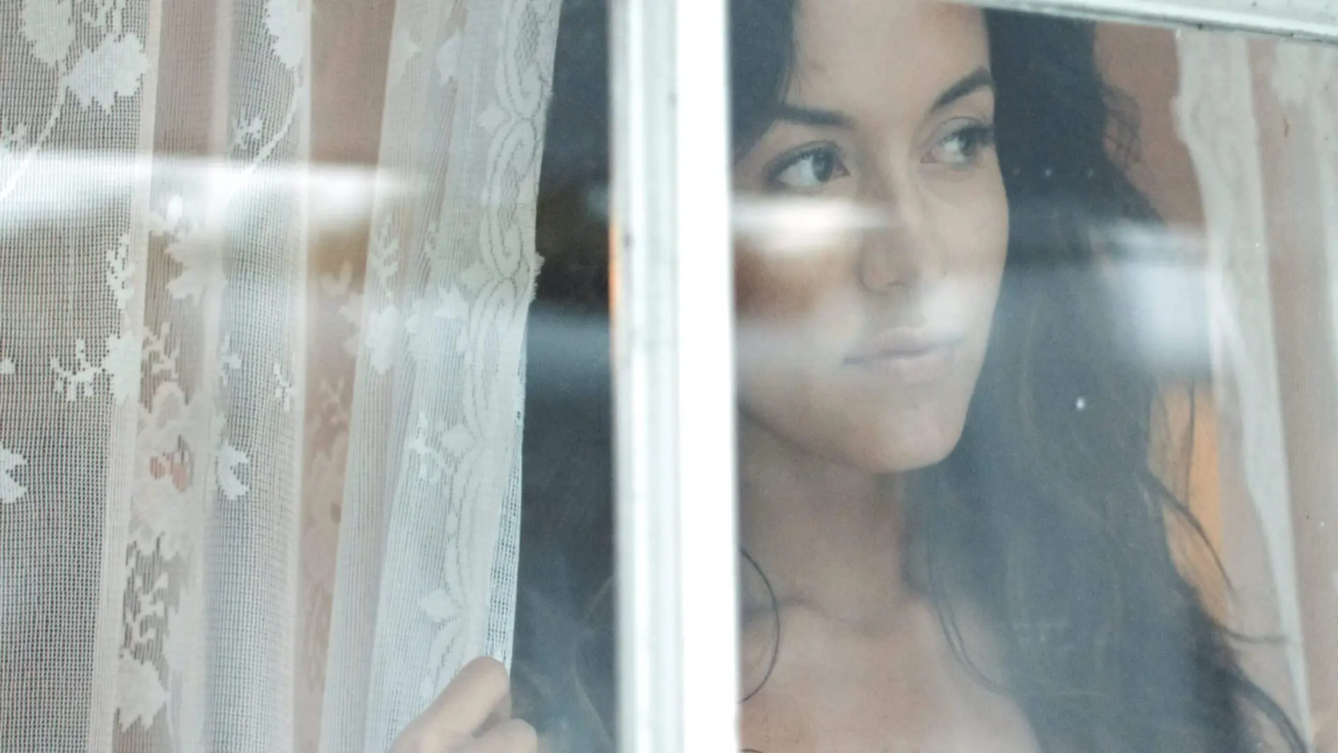 Artist Profile | Alessia Andrade 24 Closeup of Alessia Andrade looking out window