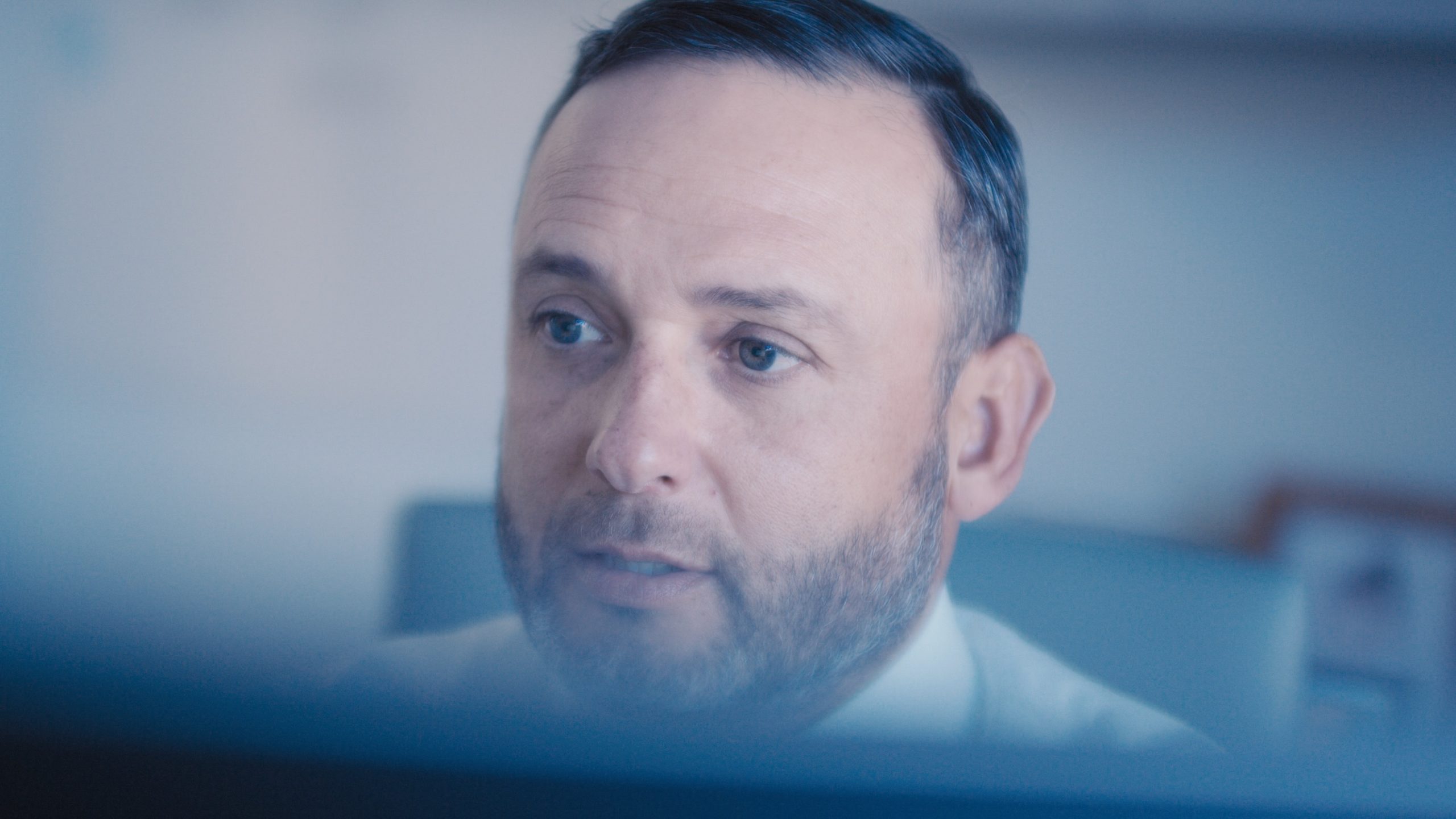 Hightower Financial Advisors Closeup headshot of a man with a salt and paper beard