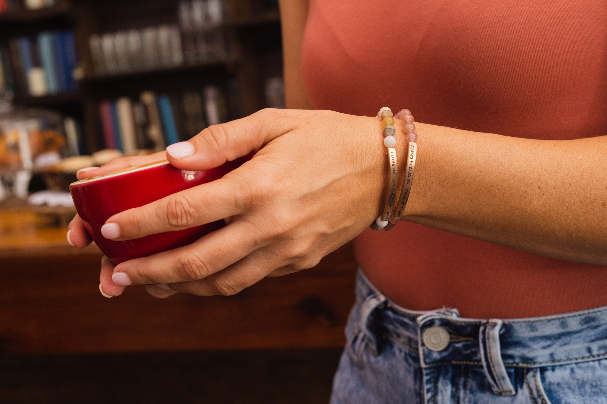 Digital Marketing in Fort Lauderdale Inspire Me Bracelets Woman wearing two bracelets holding a red cup