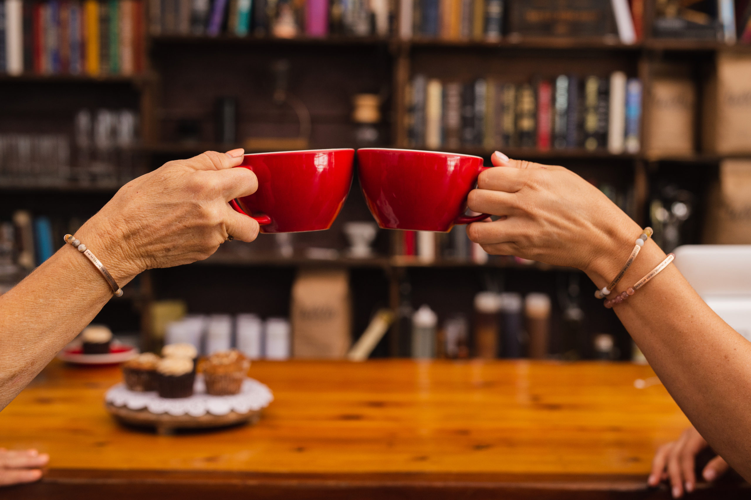 Digital Marketing in Fort Lauderdale Inspire Me Bracelets Women wearing bracelets clinking two red cups with muffins in the background