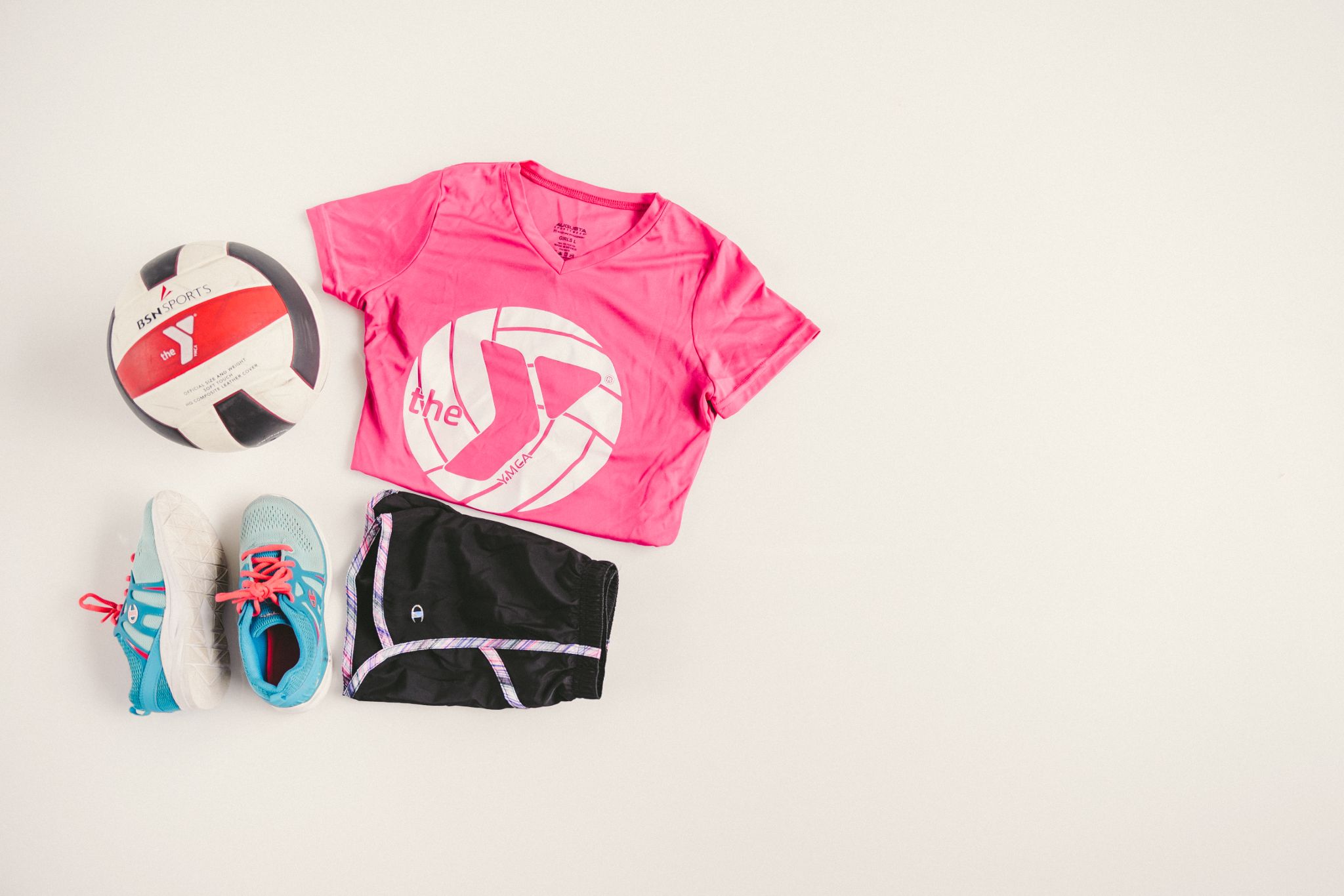 IU C&I Studios Portfolio The Y Kid black shorts, pink top, blue shoes, and soccer ball on display