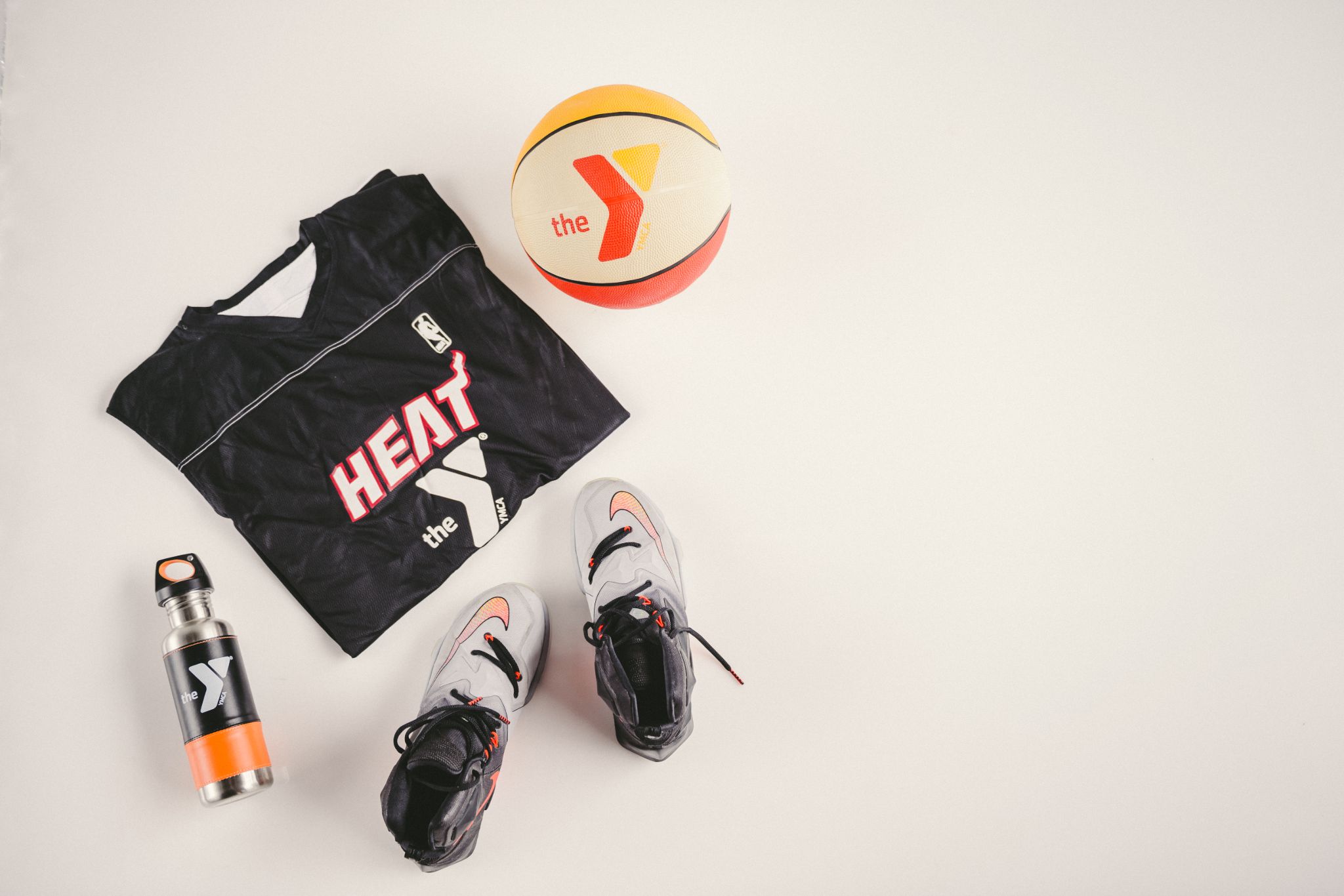 IU C&I Studios Portfolio The Y Kid black Heat basketball top, water bottle, shoes and basketball on display