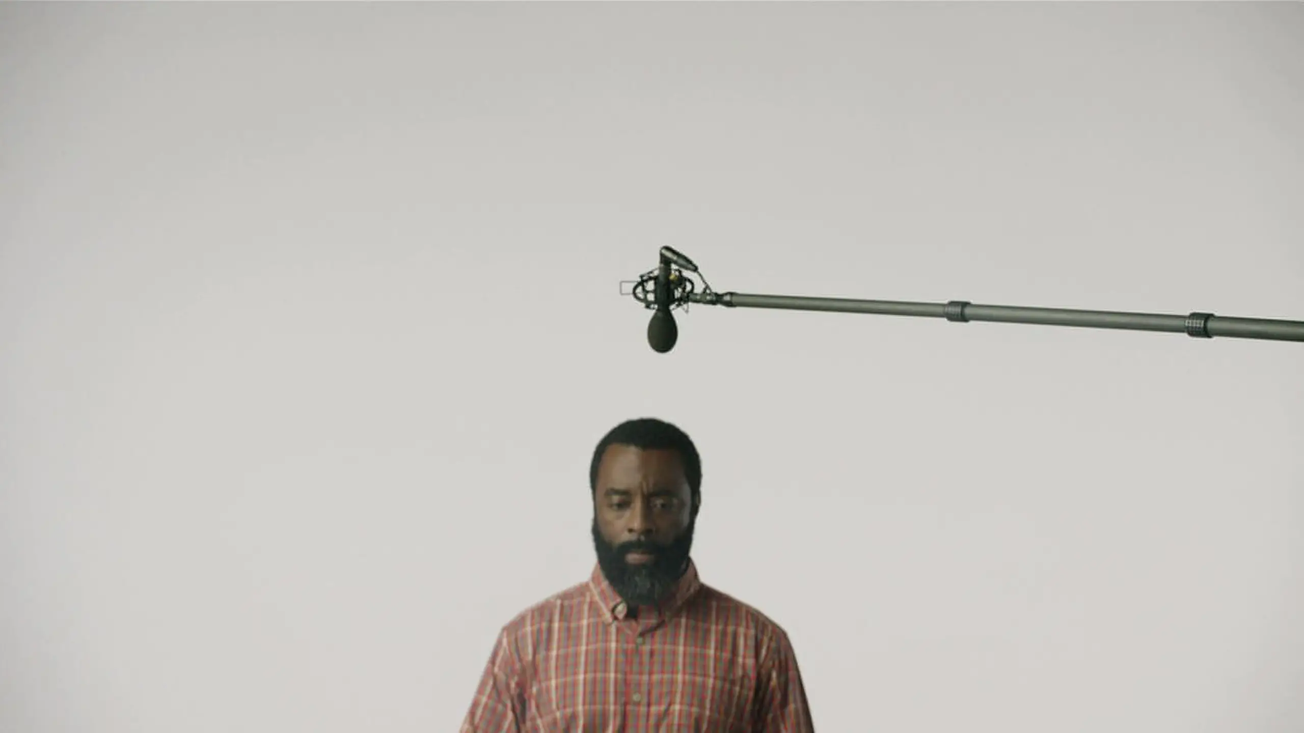 cis-post-brand-building-with-video-marketing10 View of African American man with a beard with a microphone boom above him