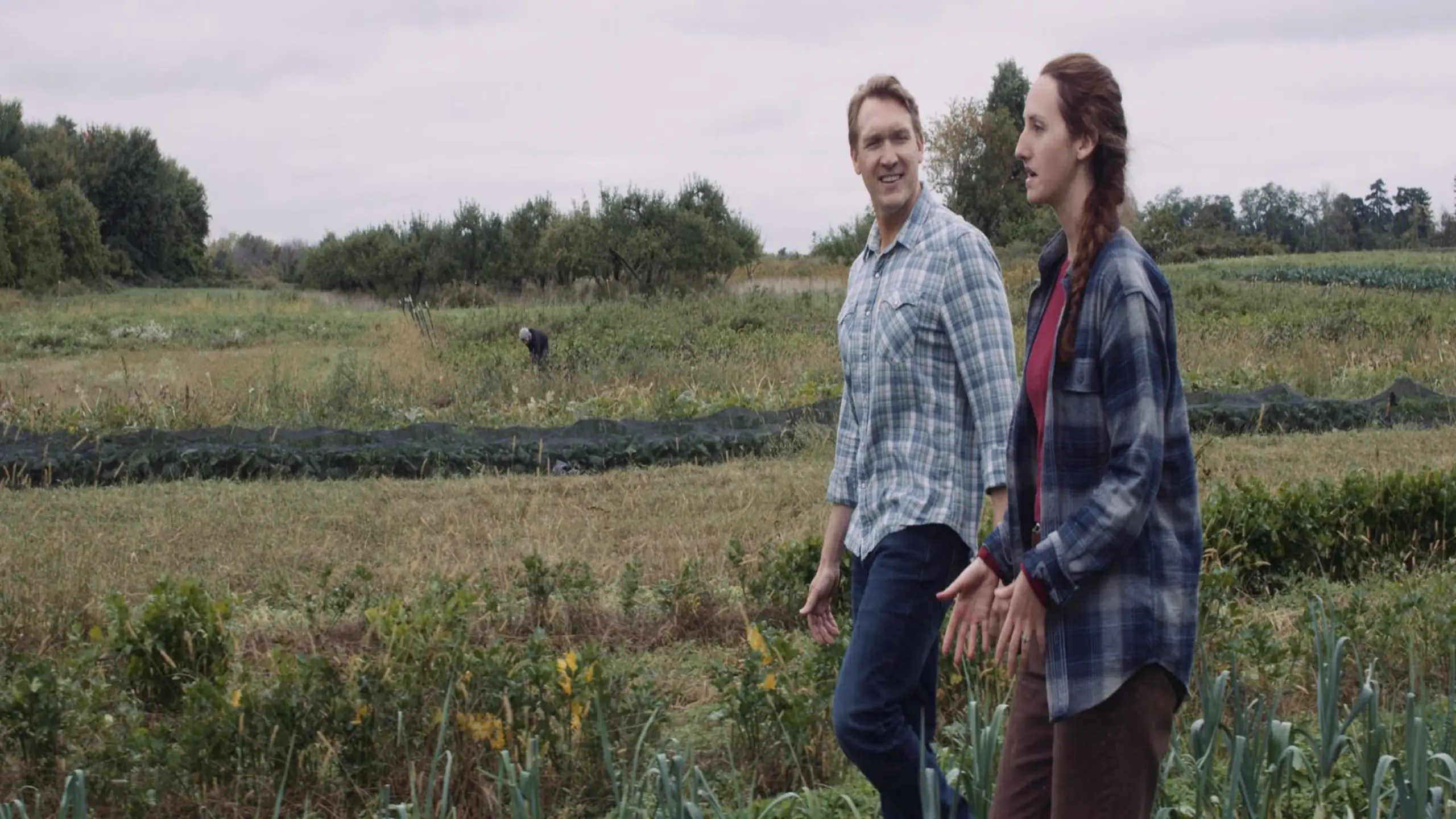 cis-post-brand-building-with-video-marketing11 Side profile of man and woman talking walking in a field