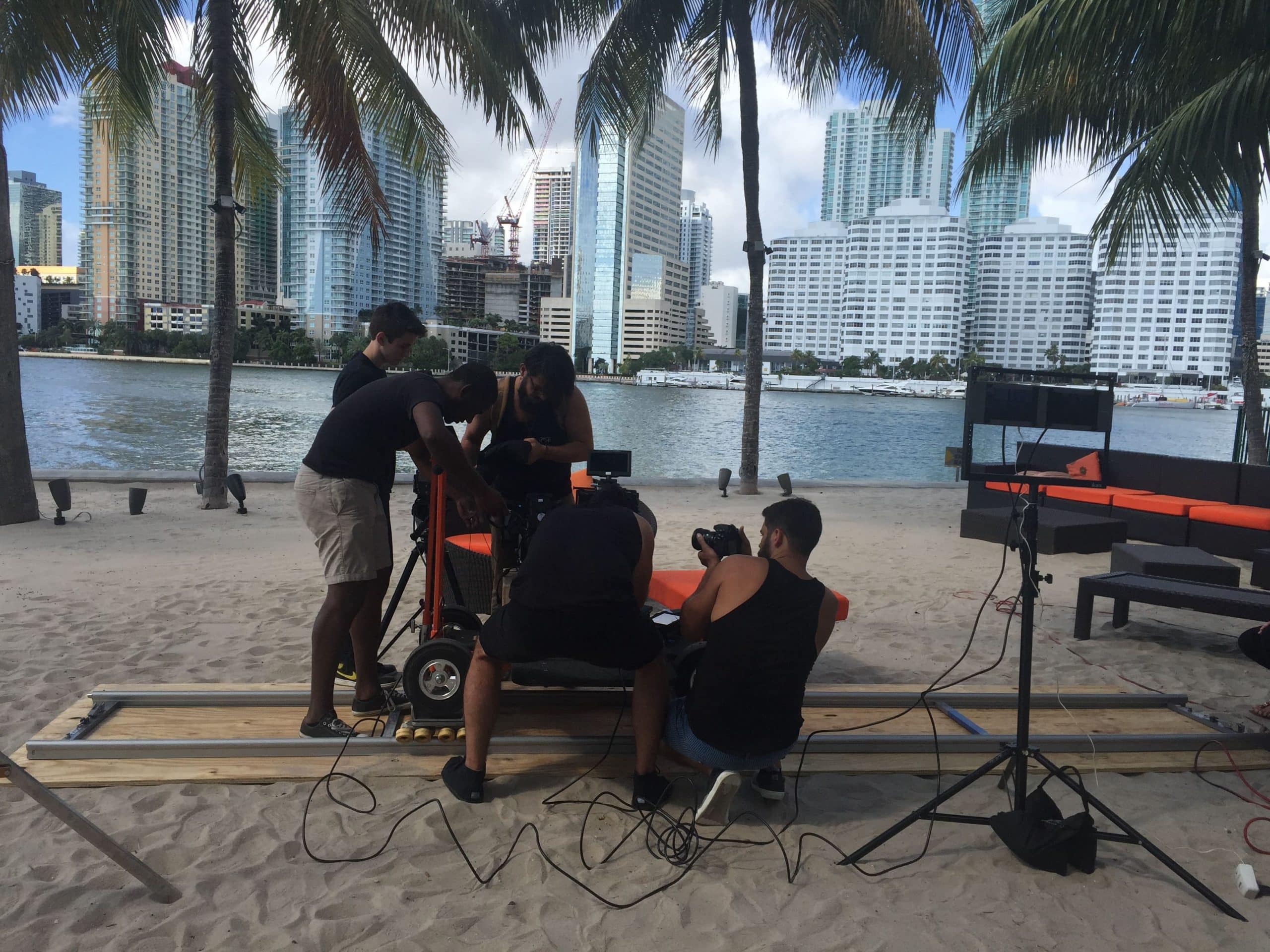 Crew of five men working on set