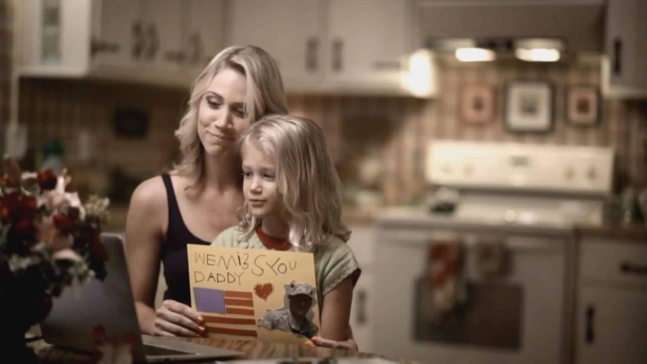 how-to-influence-others-through-video-production26 Mother with daughter on video chat with girl holding drawing for her dad