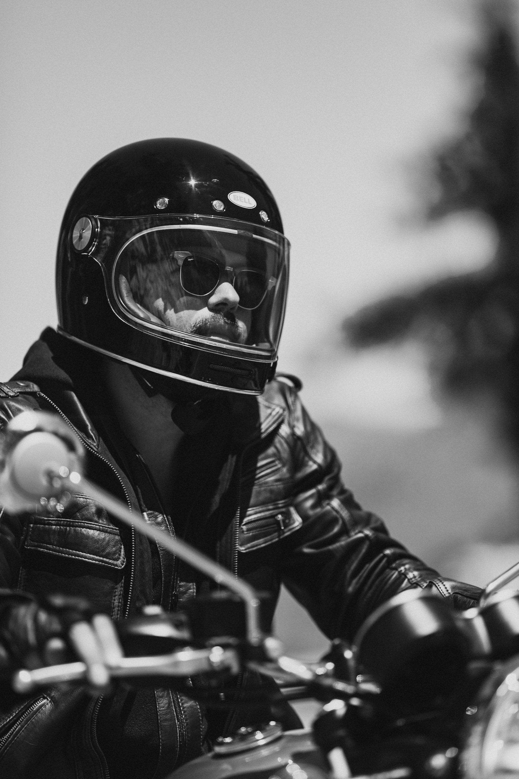 Triumph Motorcycles Euro Bike Shoot Black and white closeup of the motorcycle rider on his motorcycle