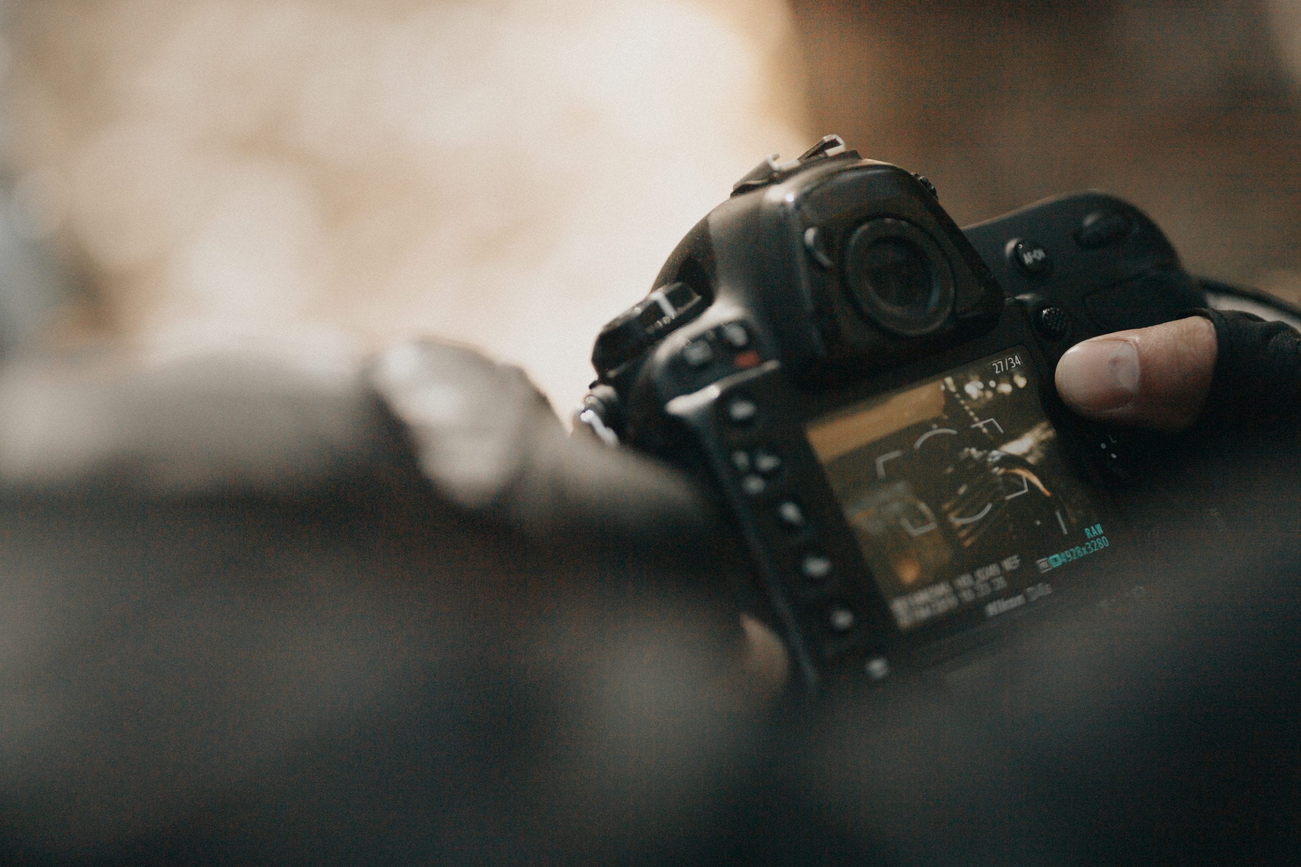 Closeup of photographer looking at camera display