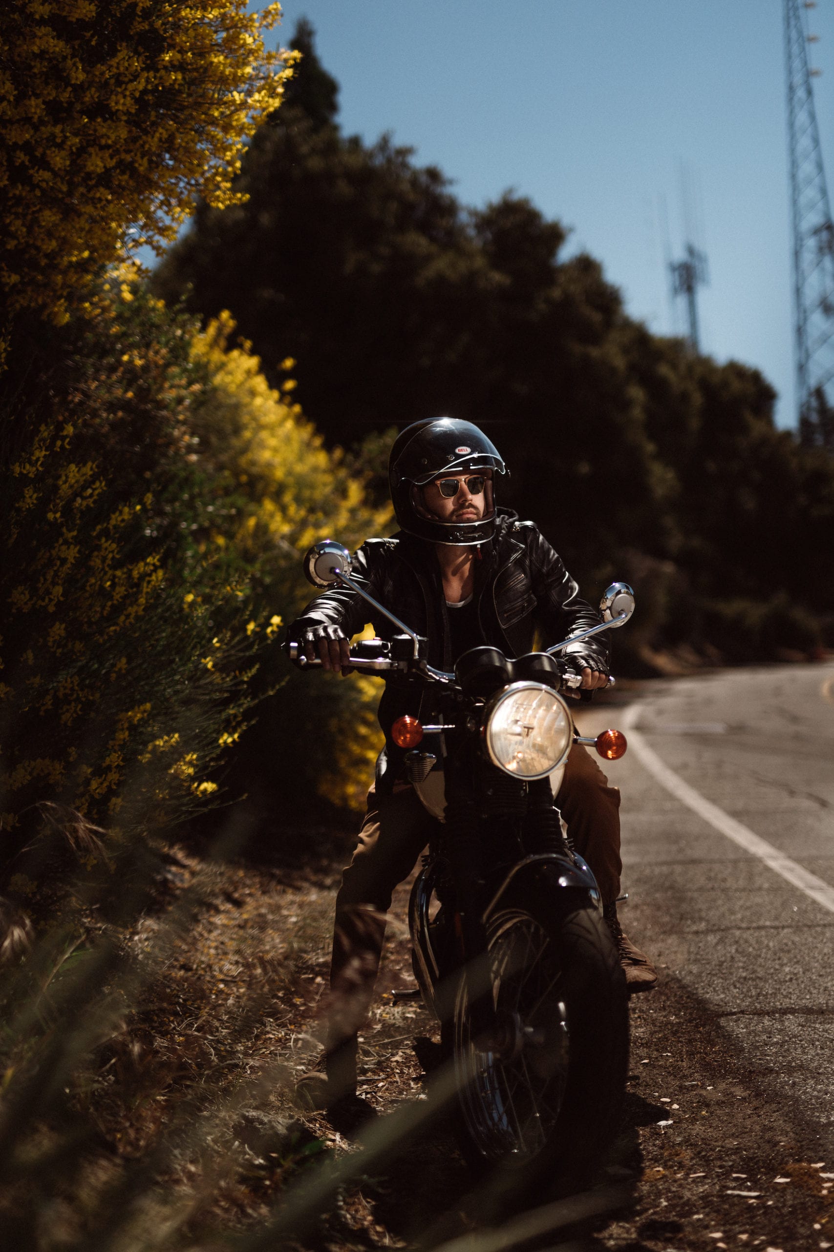 Motorcycle rider restarting the road trip after a brief pitstop