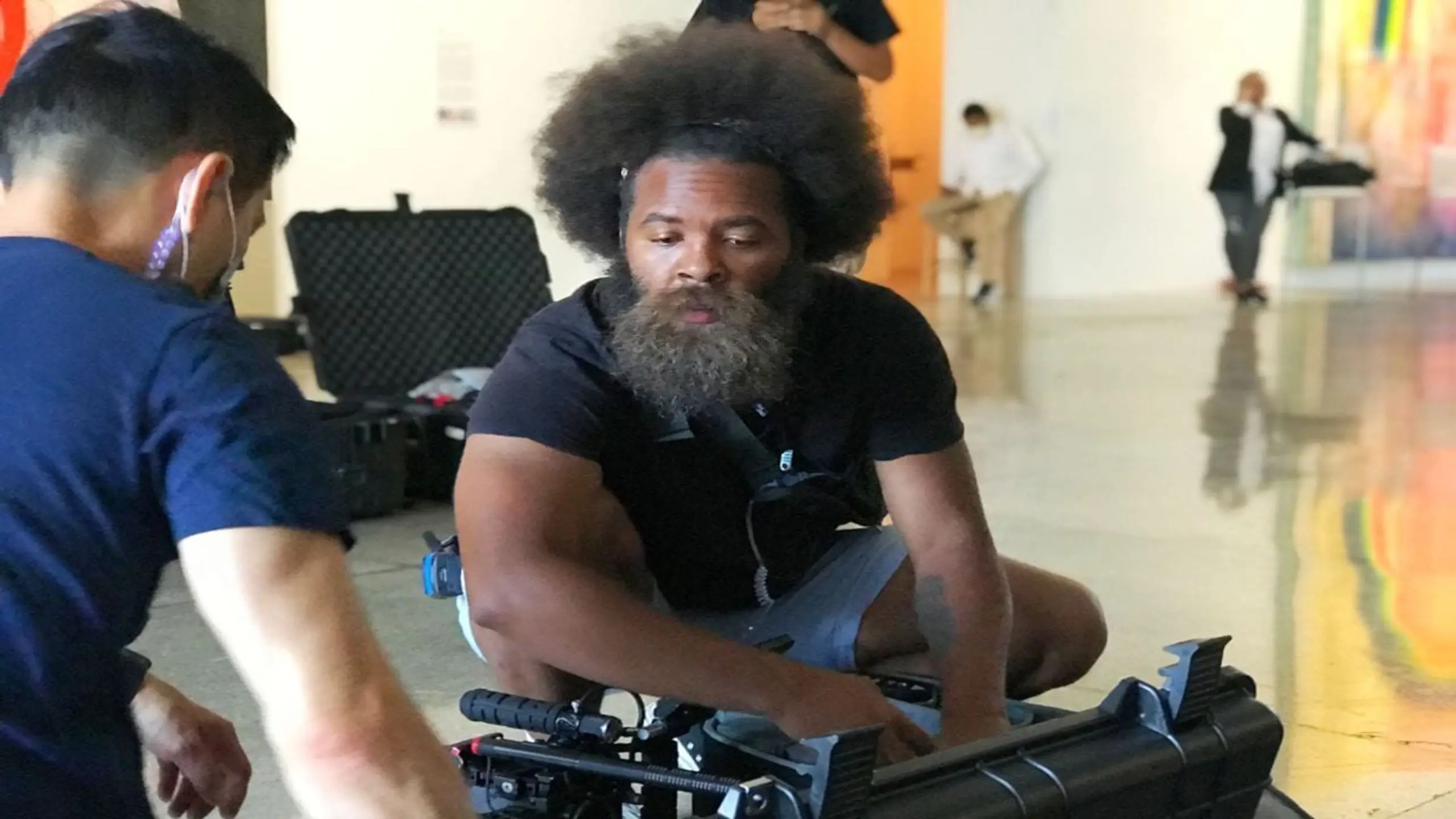 cis-post-3-secrets-to-great-storytelling-videos3 Brandon with another crew member looking over video camera