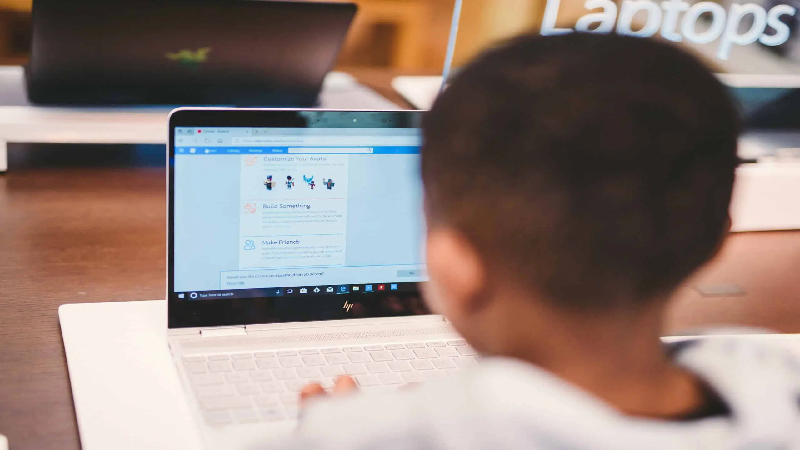 cis-post-why-invest-in-video-marketing4 View from behind of boy using a laptop