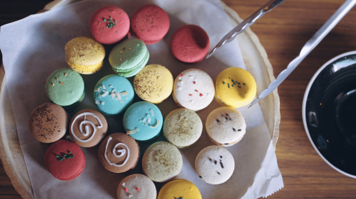Overhead view of many colors of macaroons