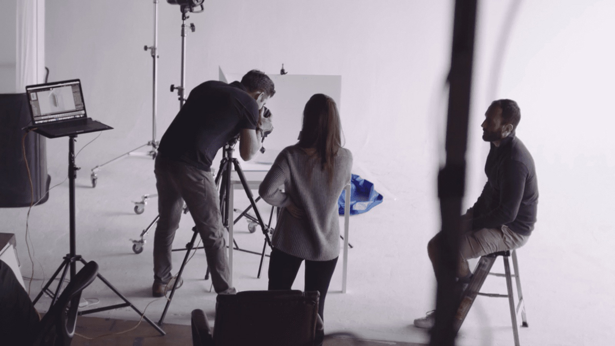 7 Reasons You Need To Invest In Video Marketing Man taking picture as a man and woman look on
